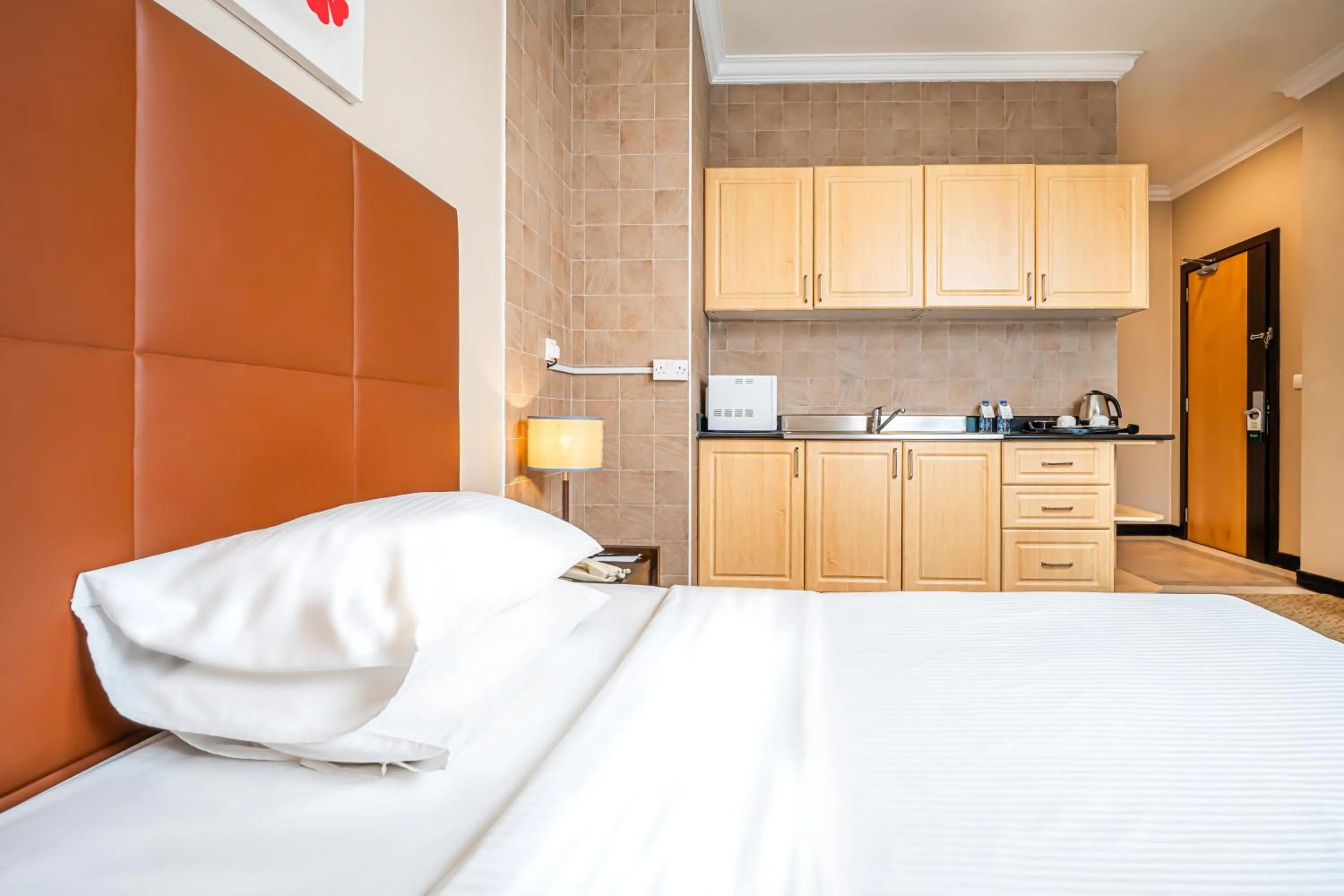 Bed in Kingsgate Hotel Doha by Millennium Hotels