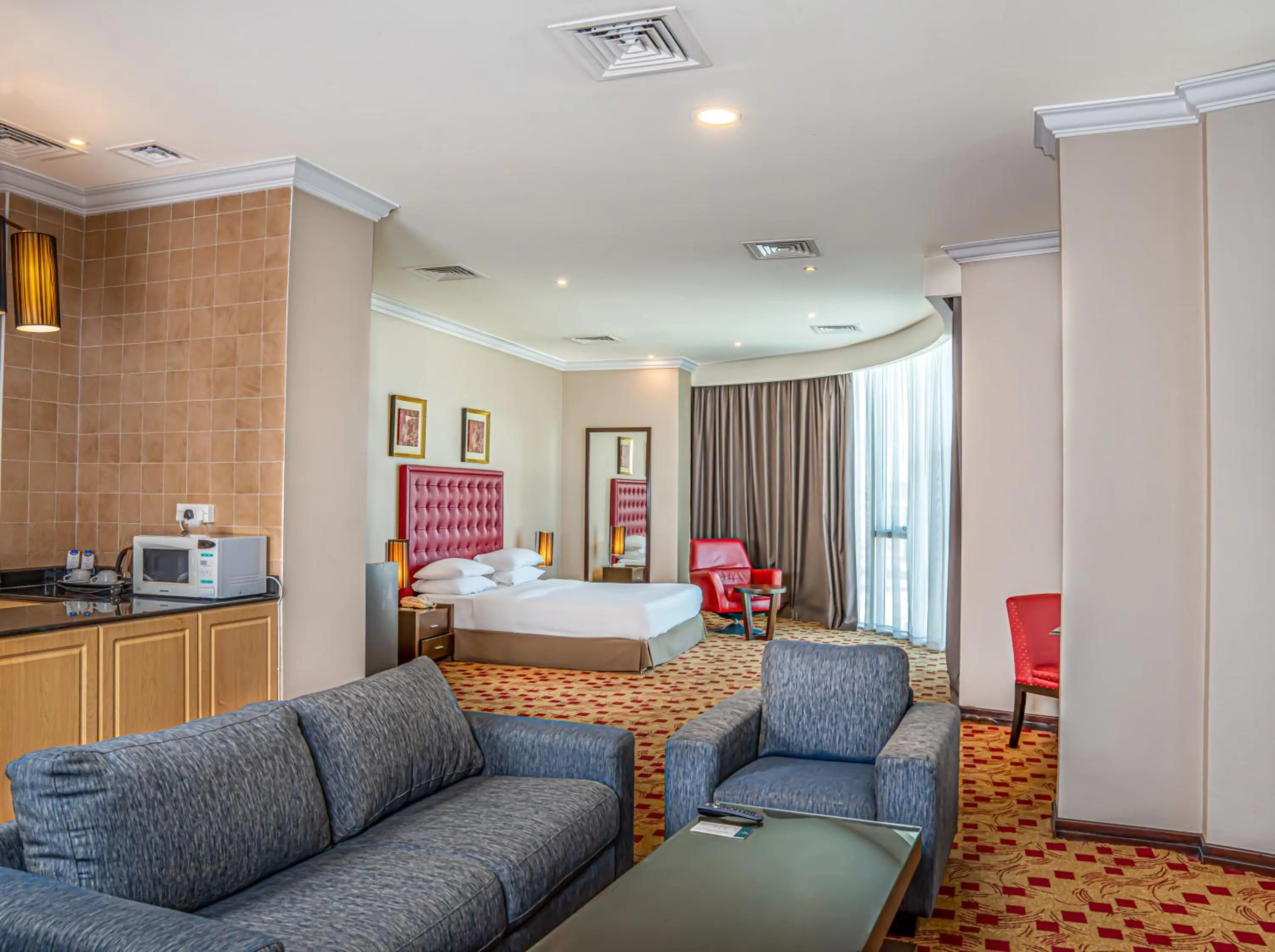 Seating area, Bed in Kingsgate Hotel Doha by Millennium Hotels
