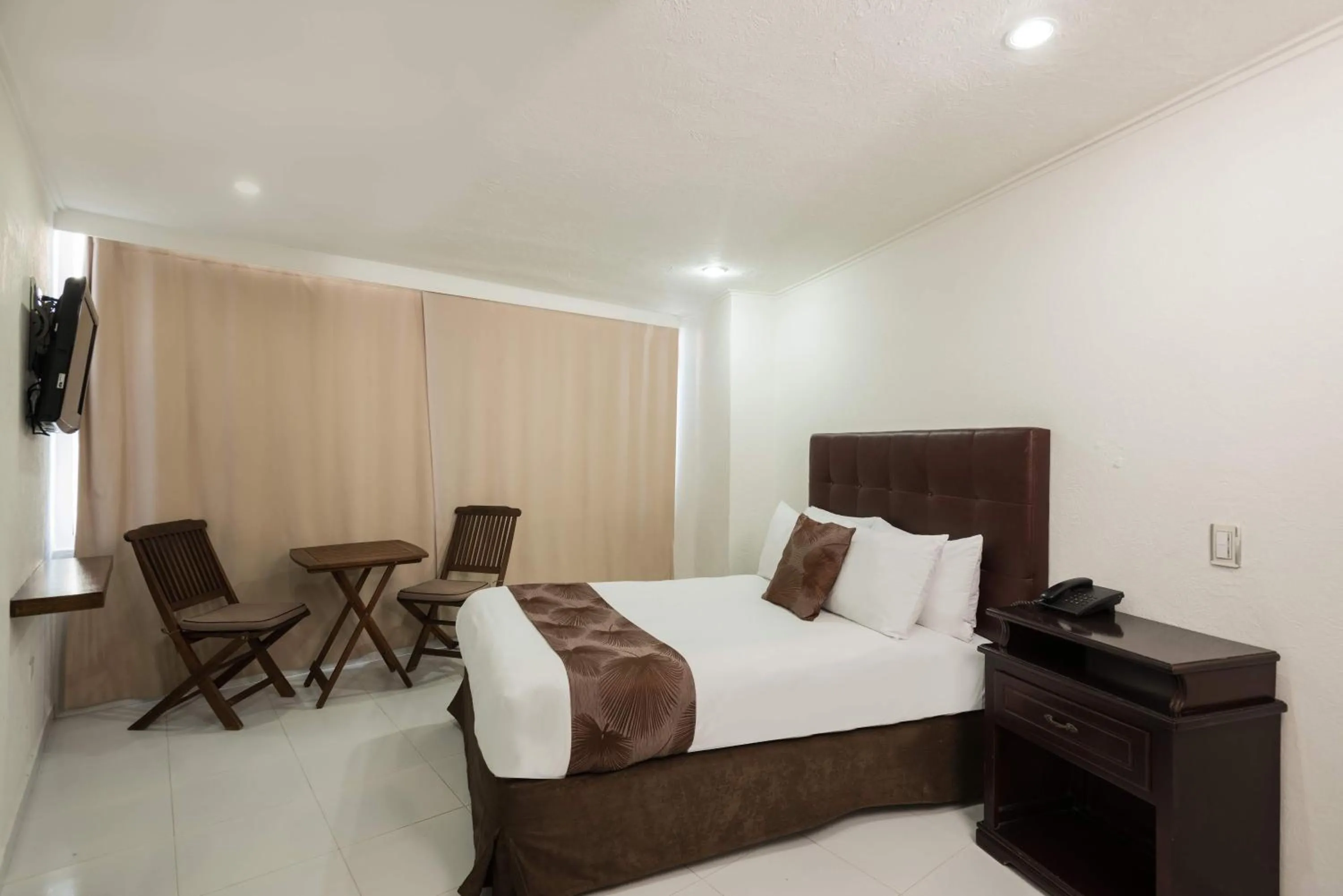 Bed in Calypso Beach Hotel