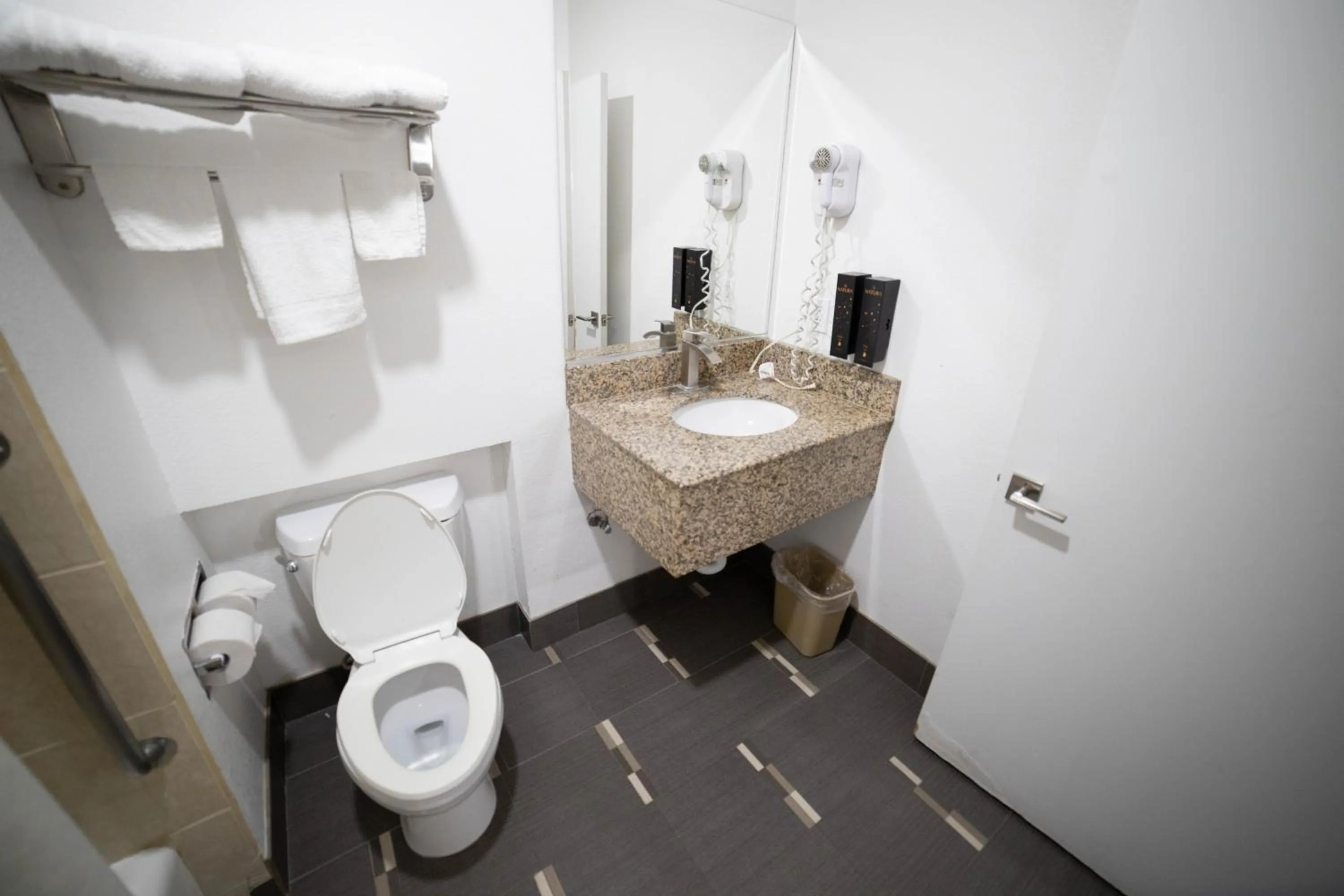 Toilet in Mid City Inn & Suites Pico Rivera