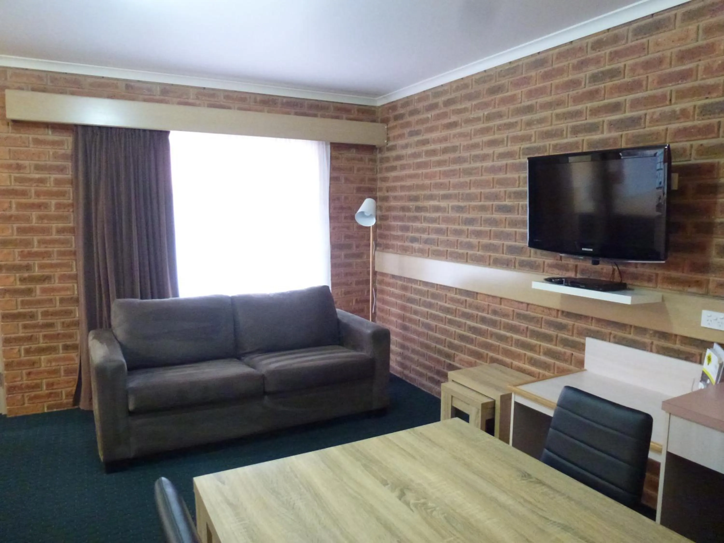 Living room in Colonial Motor Inn Bairnsdale Golden Chain Property