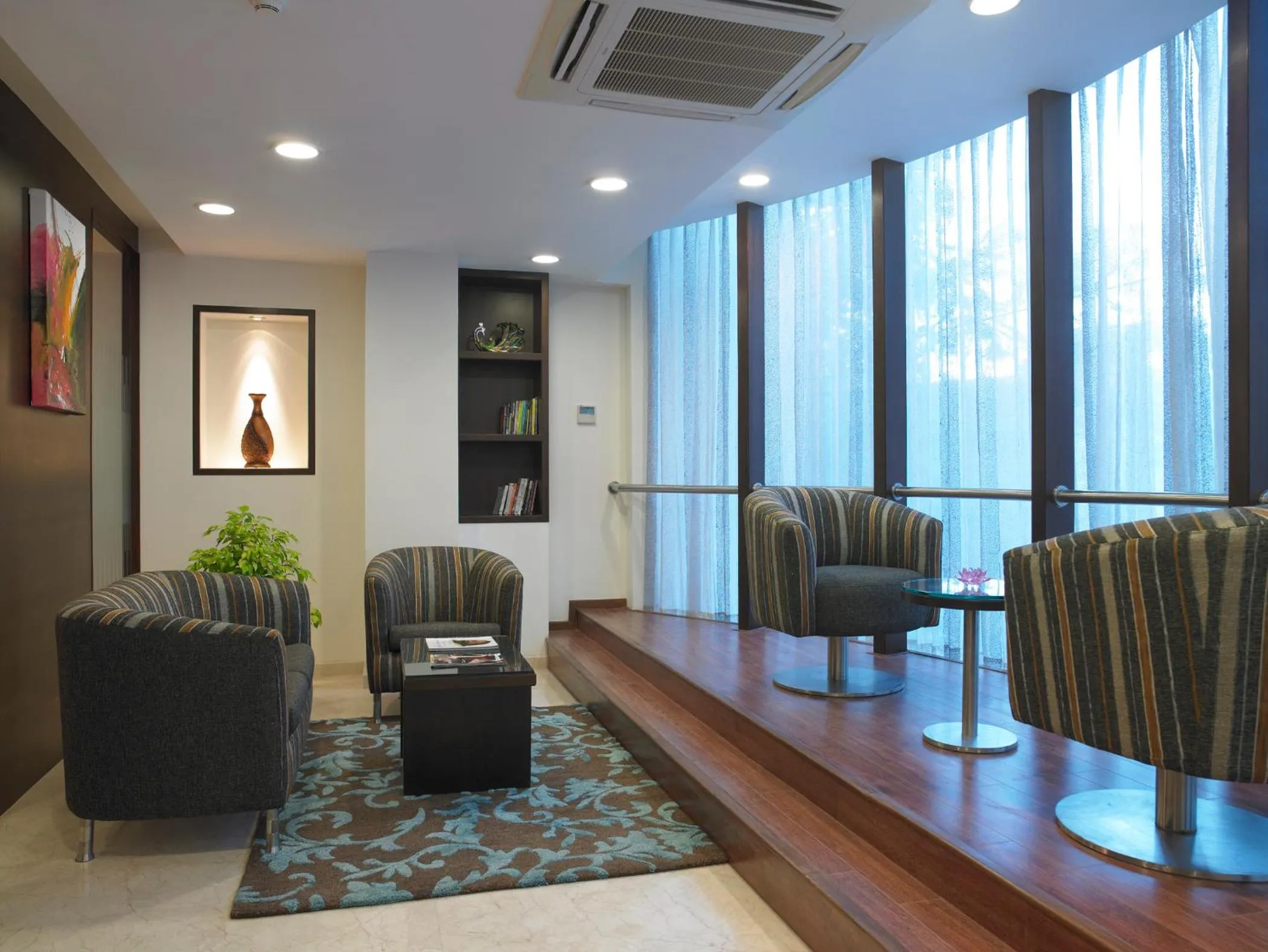 Communal lounge/ TV room in Blu Petal - A Business Hotel
