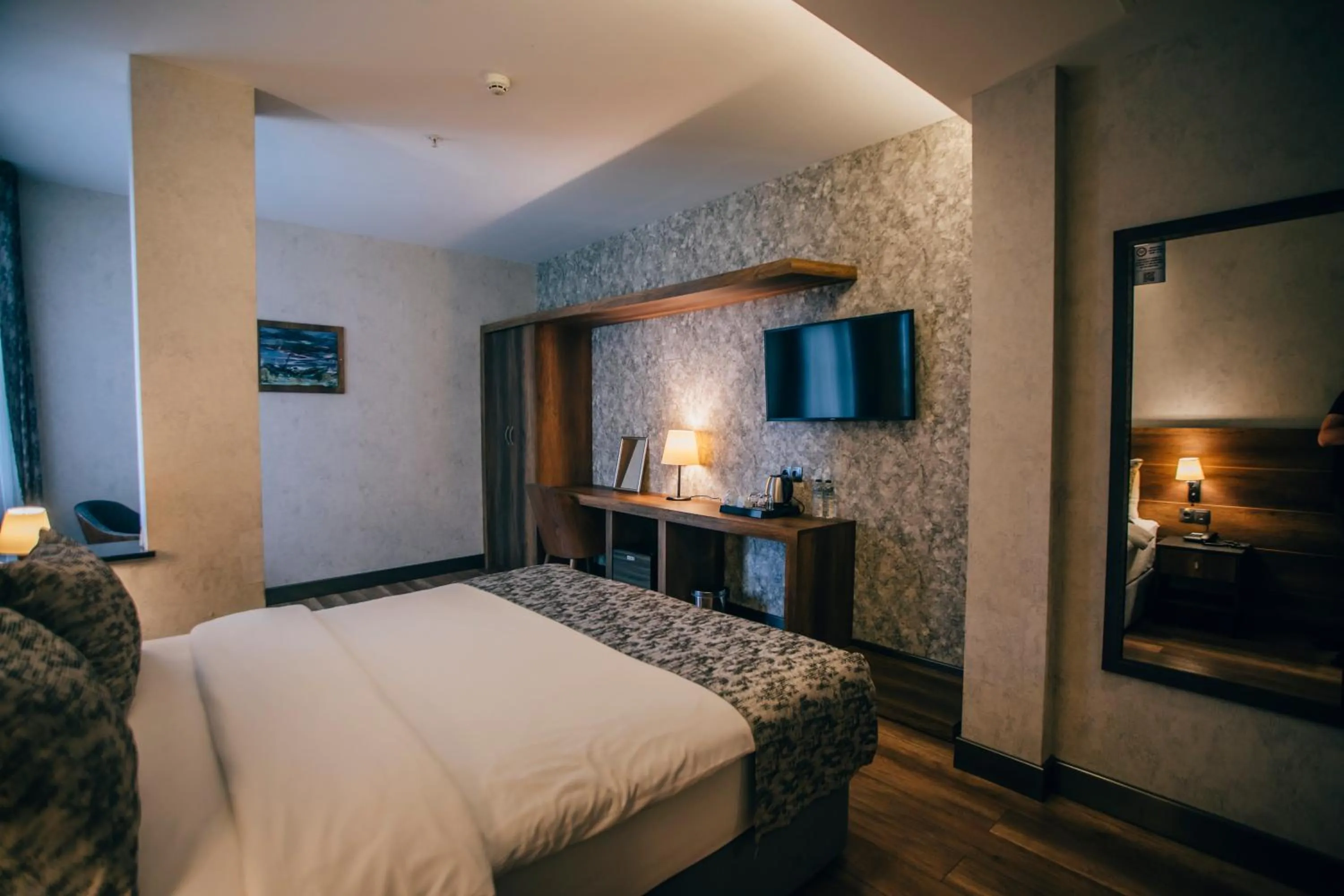 Communal lounge/ TV room, Bed in Life Point Hotel