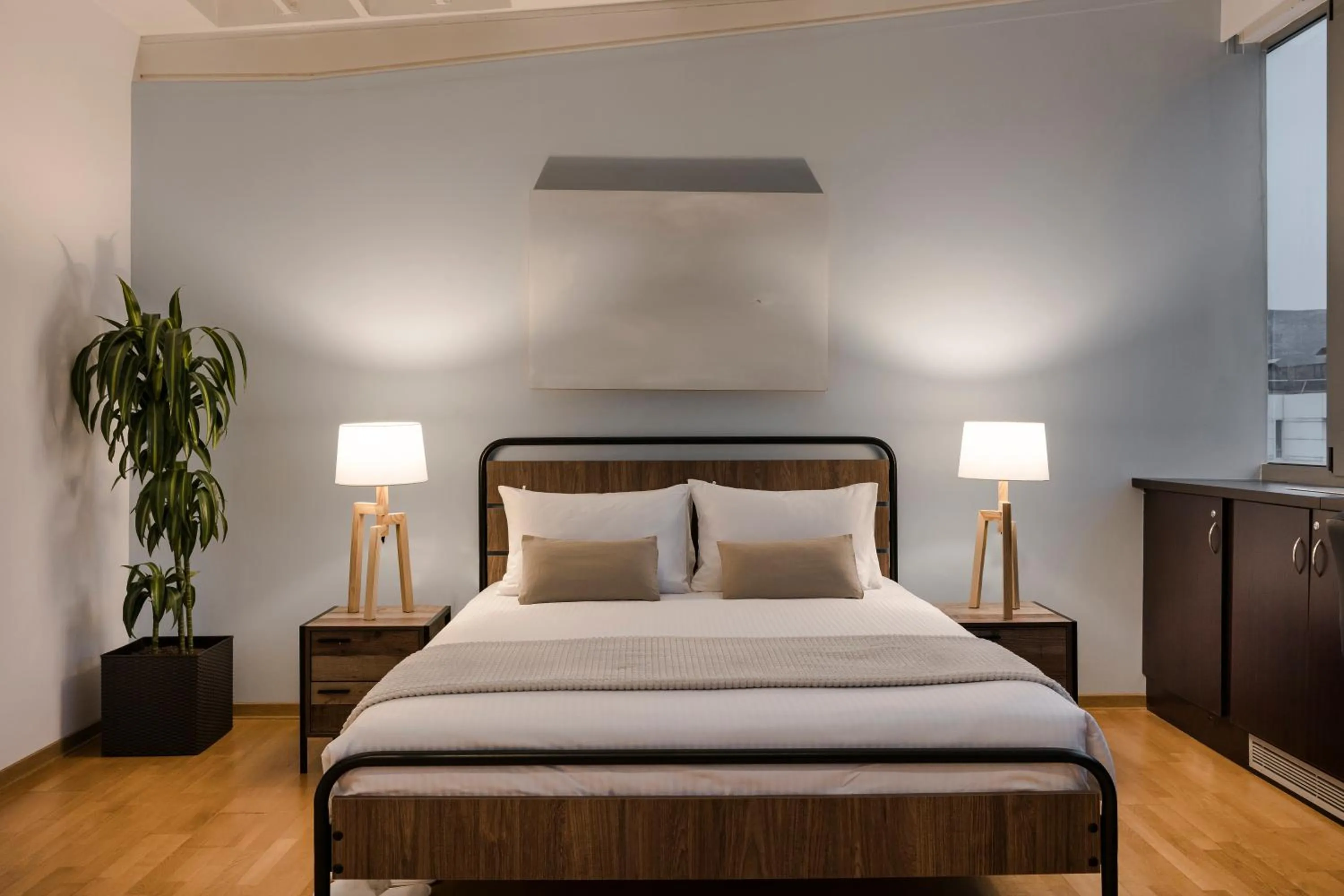 Bed in Aria Acropolis Suites, Troulanda