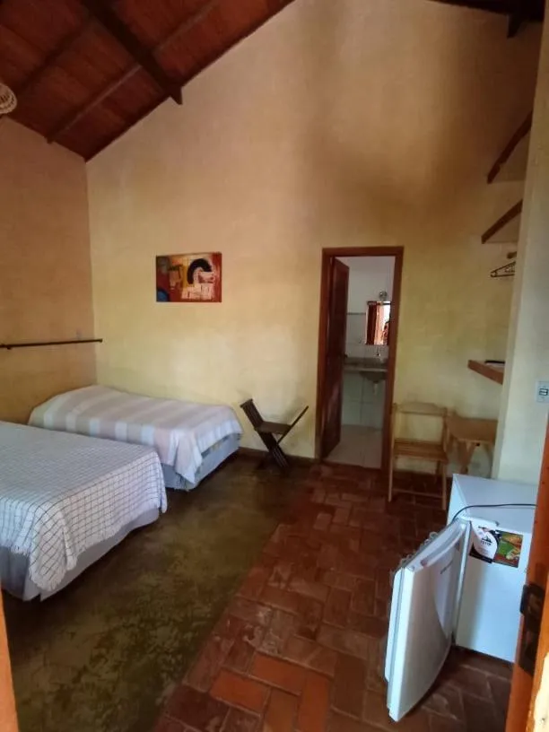 Bed in Pousada Opicodocipo