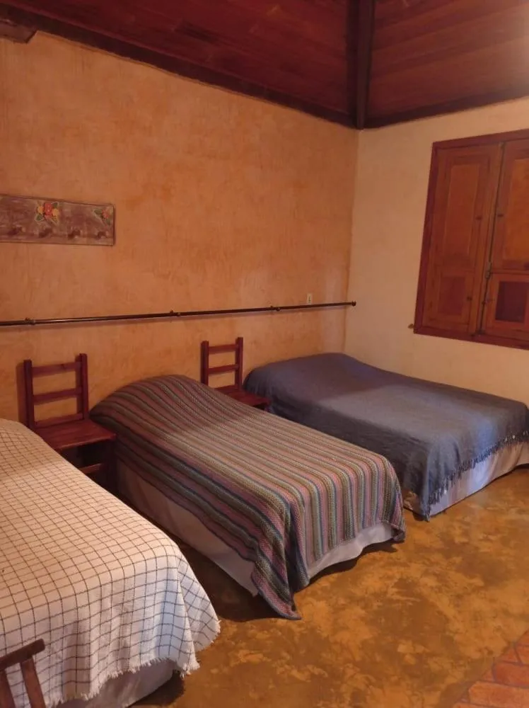 Bed in Pousada Opicodocipo