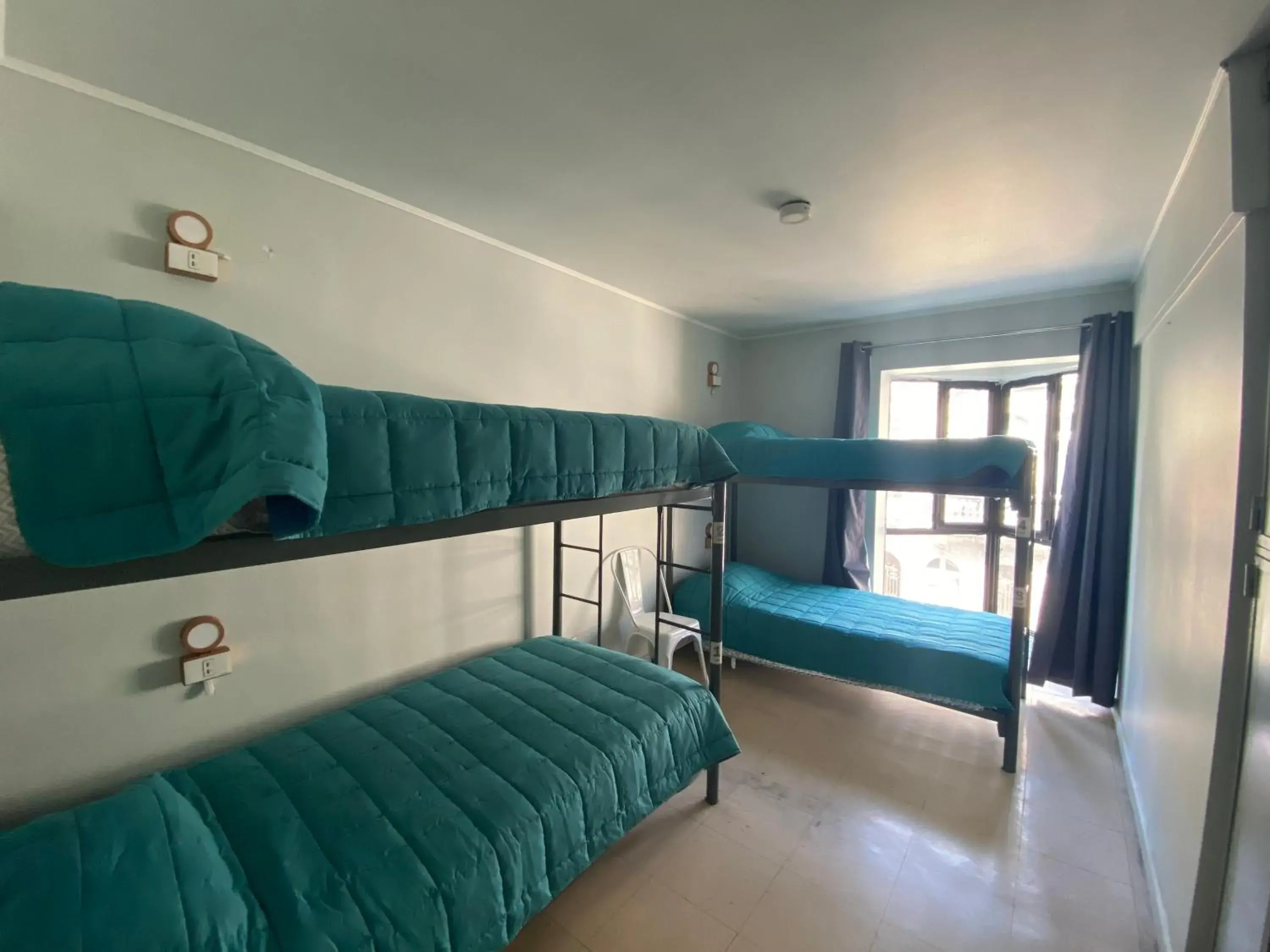 Bed in 4-Bed Female Dormitory Room in Hostel Cienfuegos Santiago Centro Bed in 4-Bed Female Dormitory Room in Hostel Cienfuegos Santiago Centro