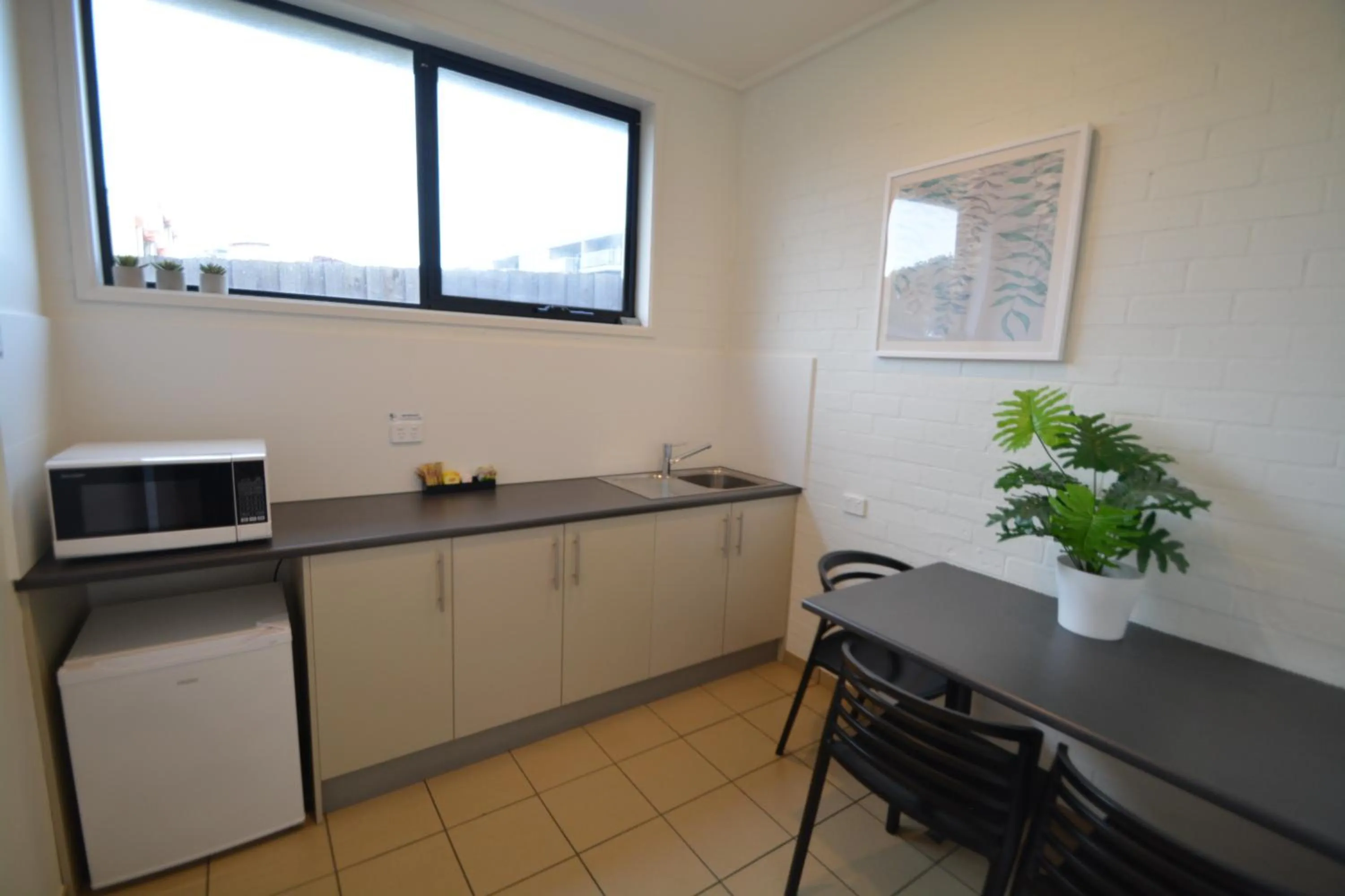 Kitchen or kitchenette in Beachfront Motel