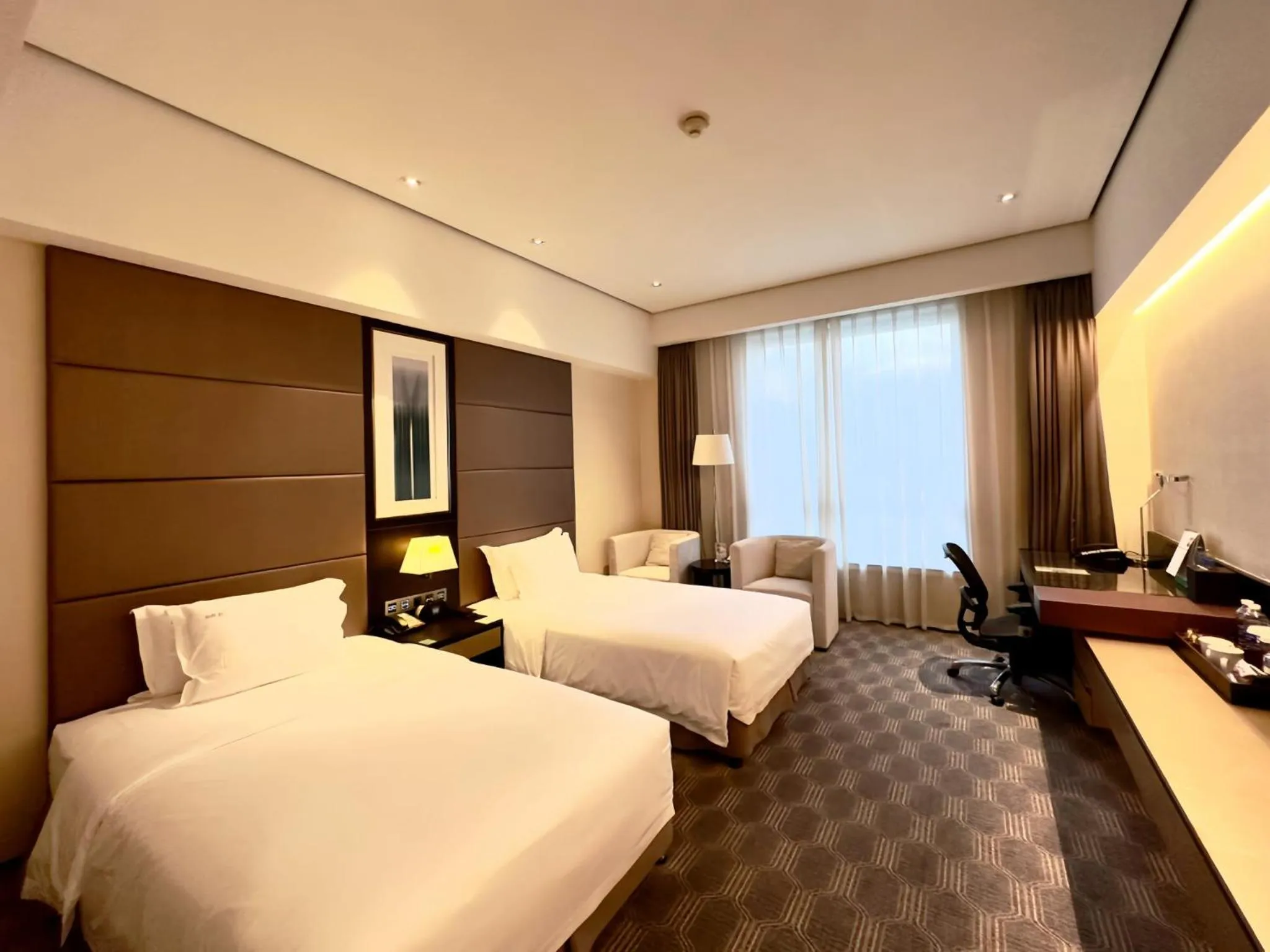 Photo of the whole room, Bed in Holiday Inn Nantong Oasis International by IHG
