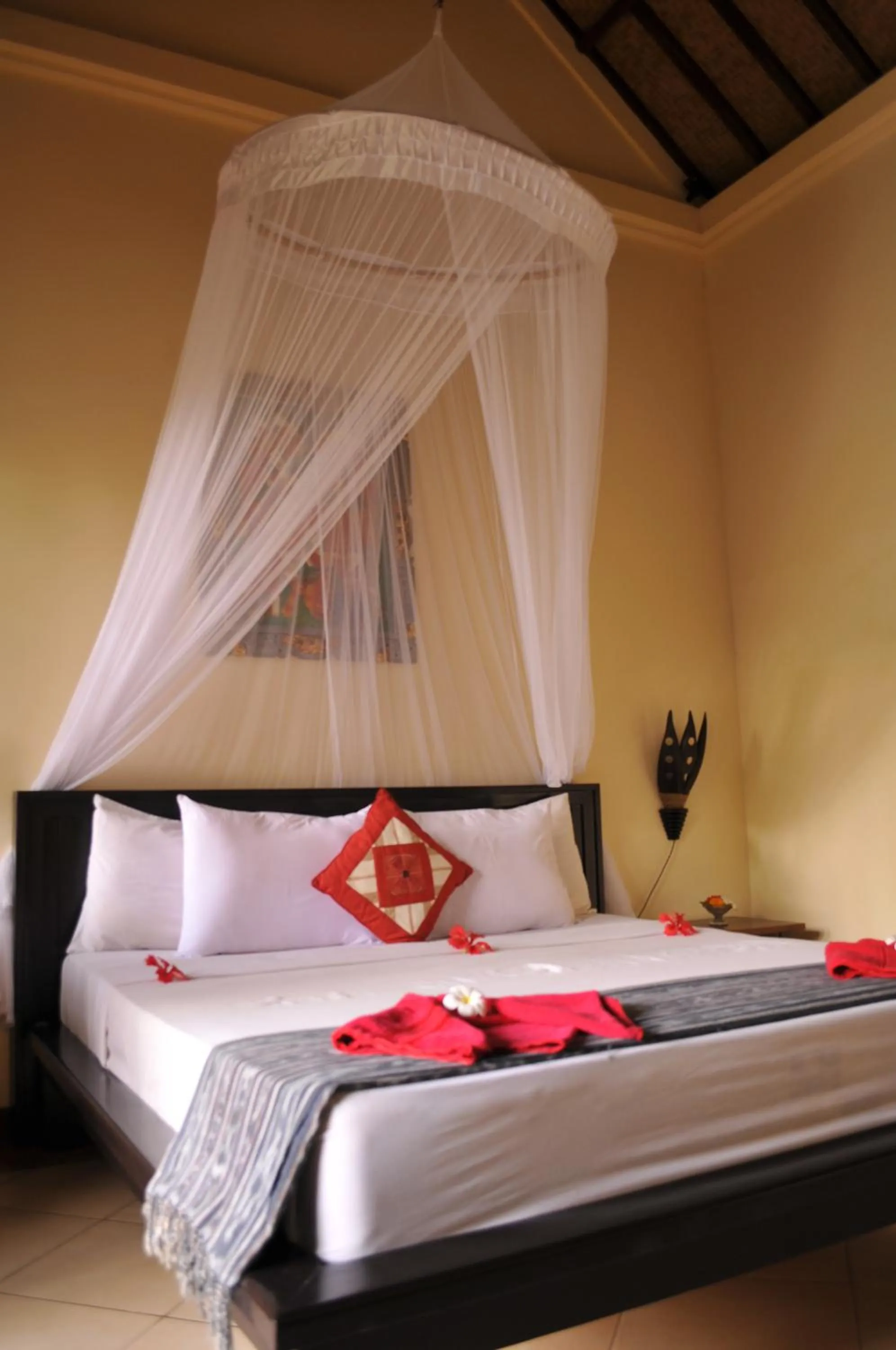 Bed in Tirta Sari Bungalow