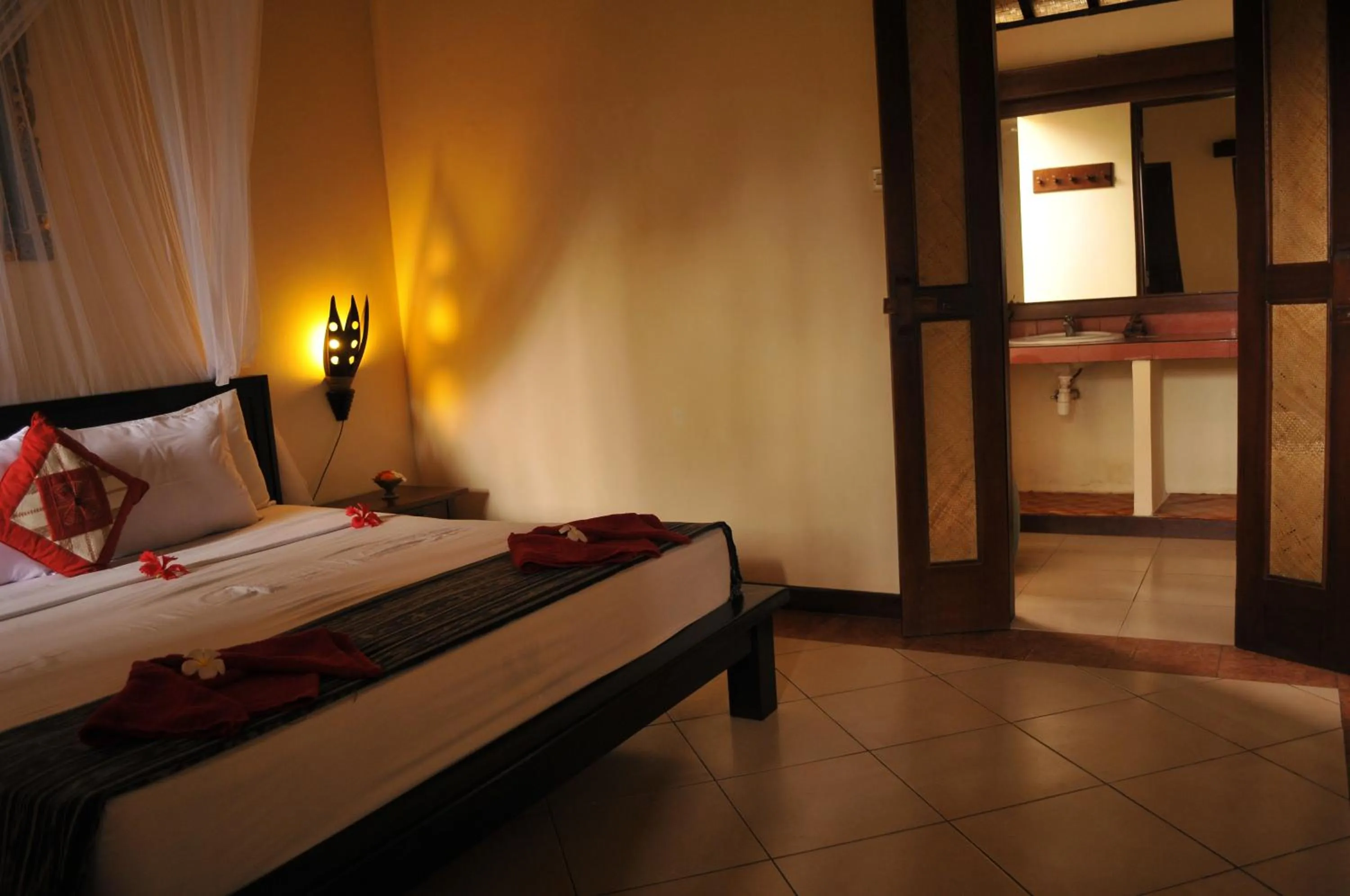 Bathroom, Bed in Tirta Sari Bungalow