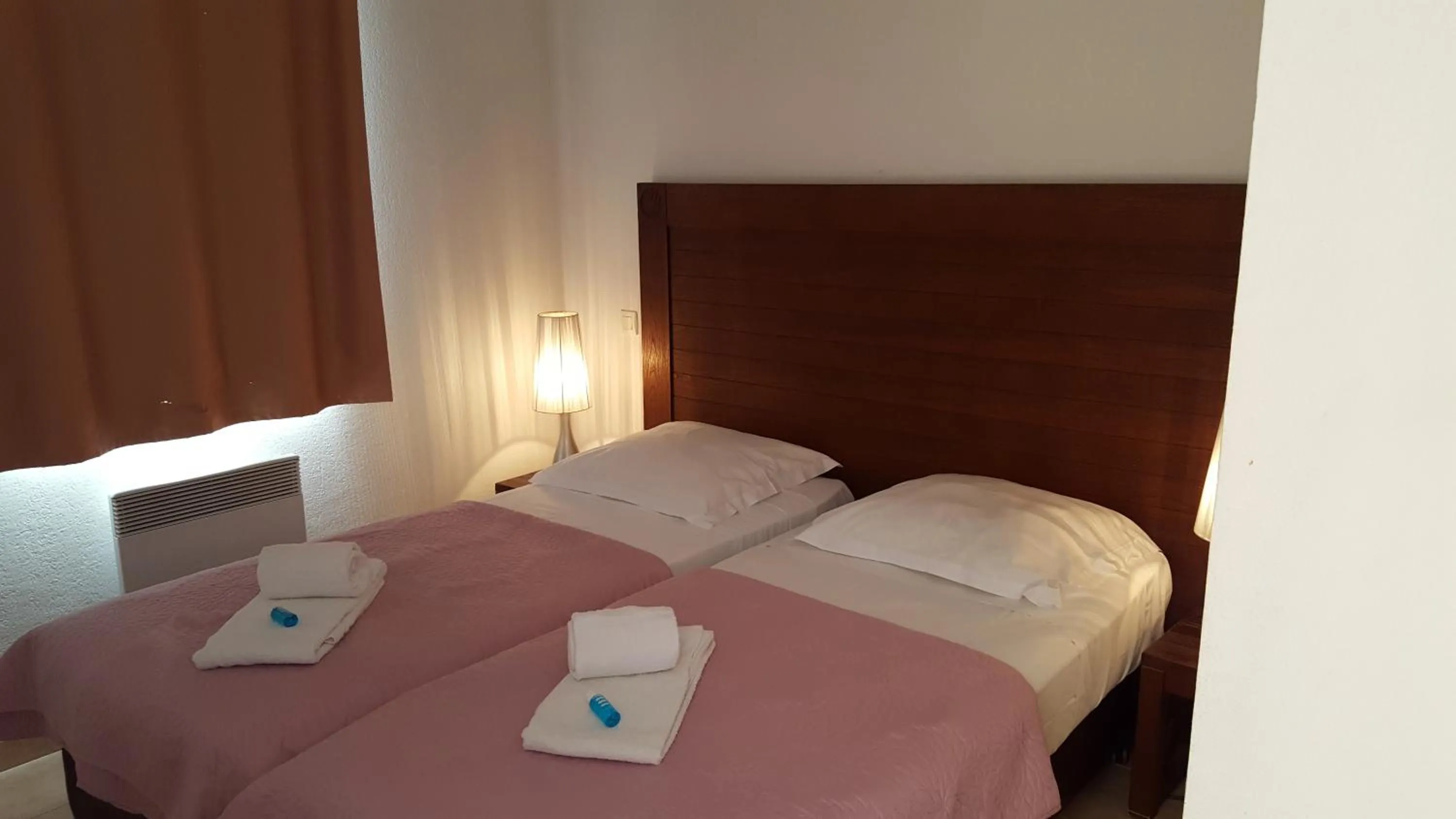 Bedroom in UZES APPART HOTEL Résidence Le Mas des Oliviers