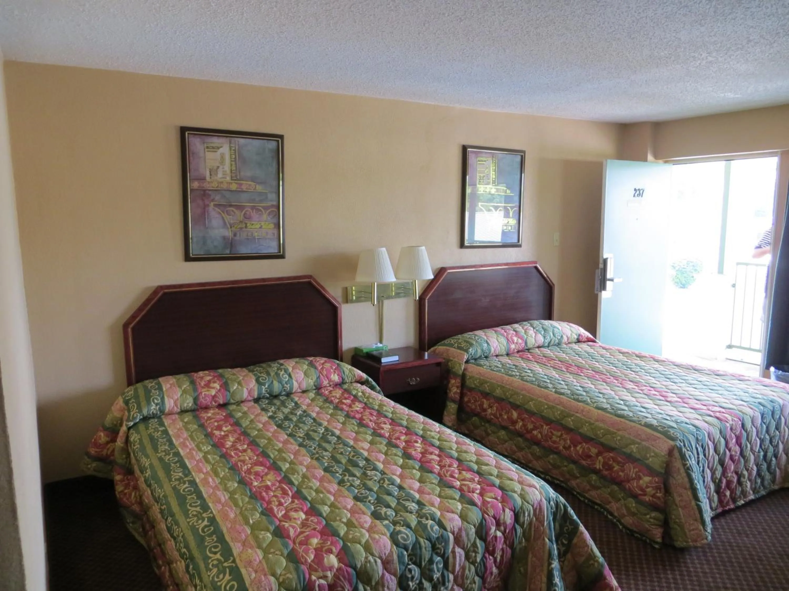 Bed in Red Carpet Inn