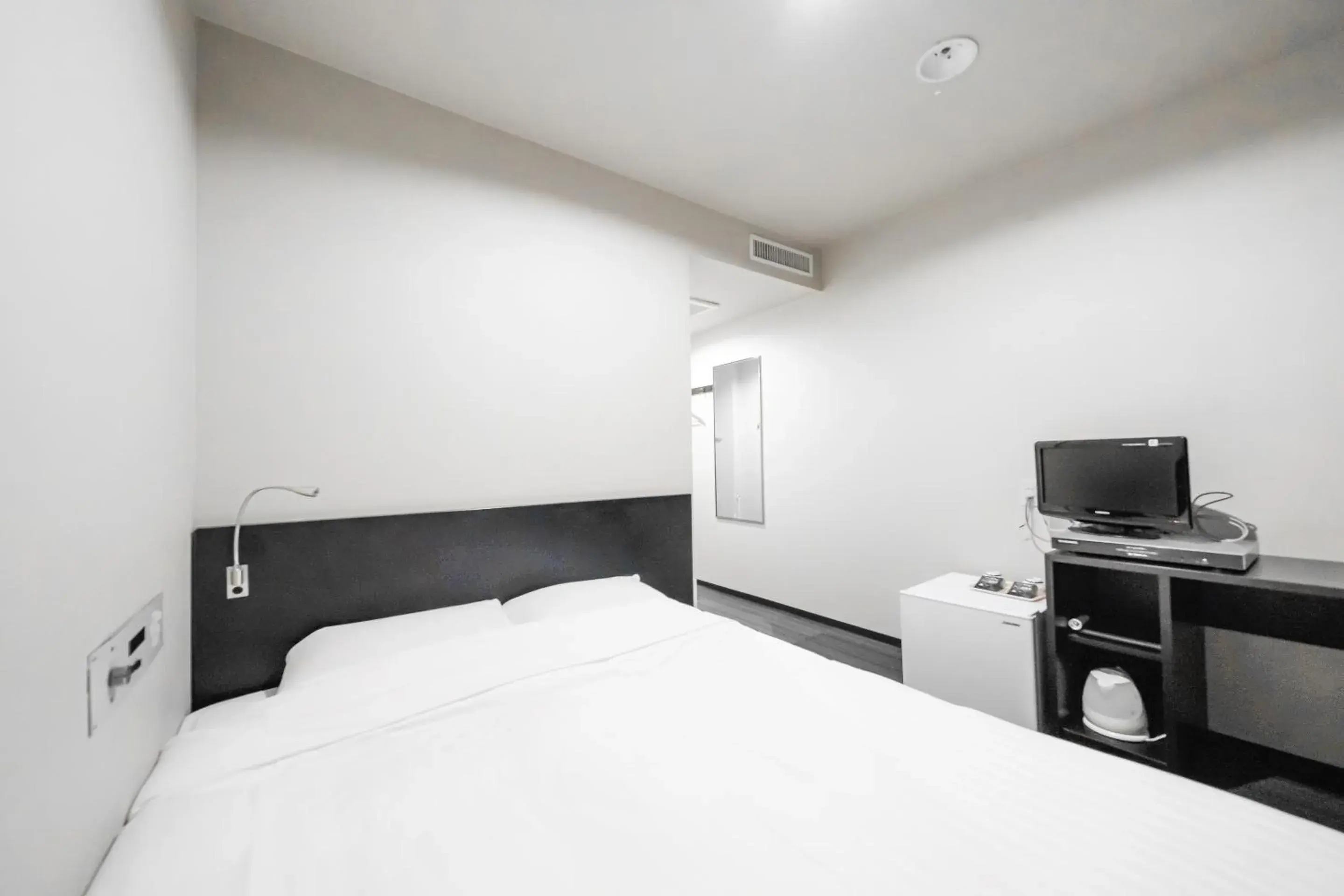 Bed in Tabist Annex Hotel Tetora Hakodate Bed in Tabist Annex Hotel Tetora Hakodate