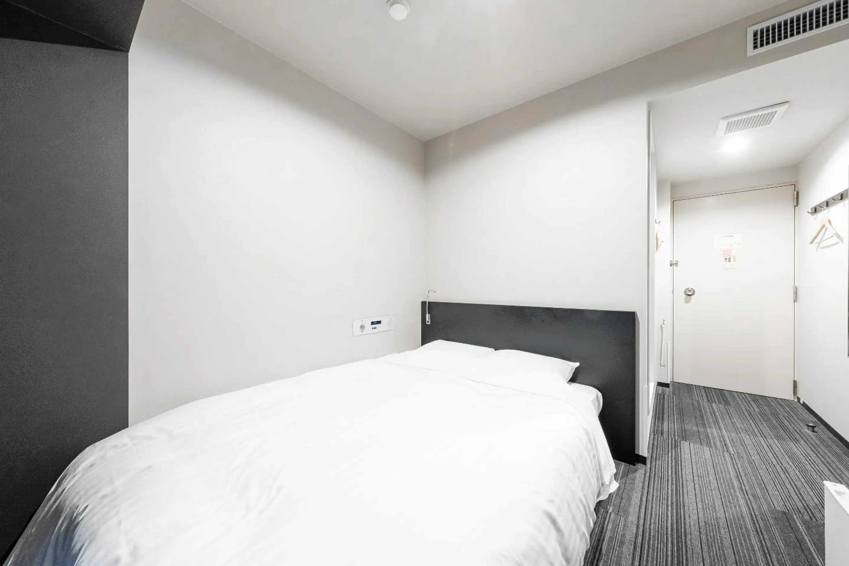 Bed in Tabist Annex Hotel Tetora Hakodate Bed in Tabist Annex Hotel Tetora Hakodate