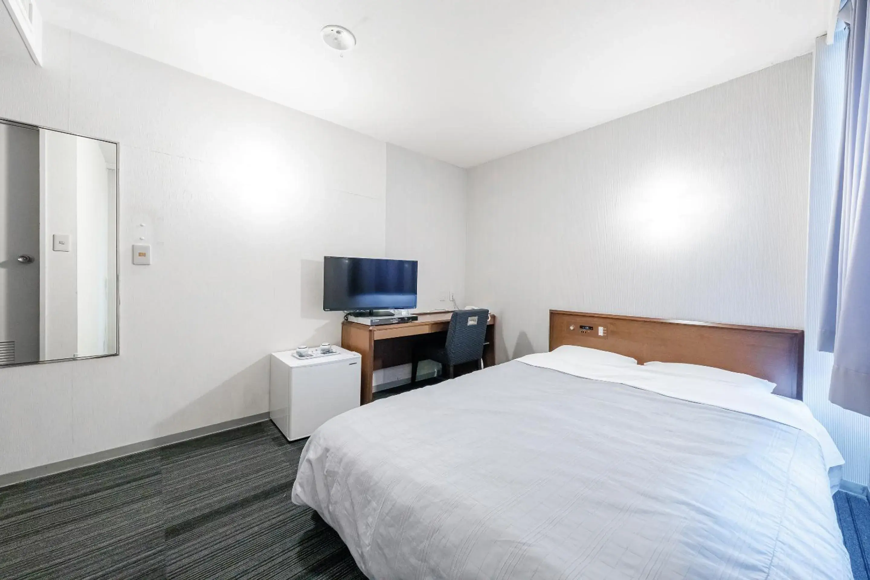 Bed in Tabist Annex Hotel Tetora Hakodate Bed in Tabist Annex Hotel Tetora Hakodate