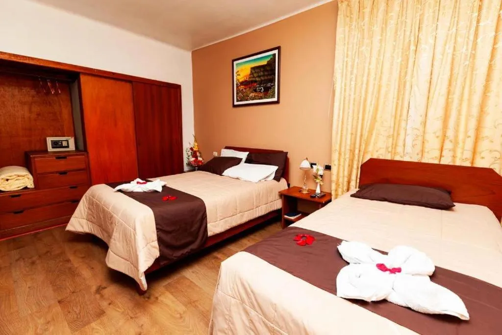 Bed in Hotel Sol del Oriente Cusco