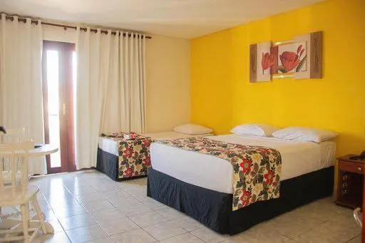 Bed in Hotel Três Palmeiras