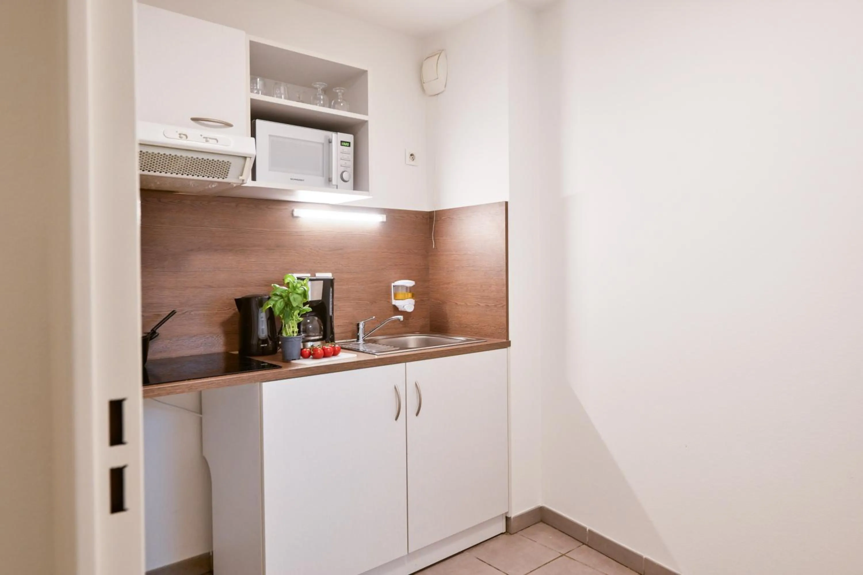 kitchen in Comfort Aparthotel Versailles, St Cyr l'Ecole