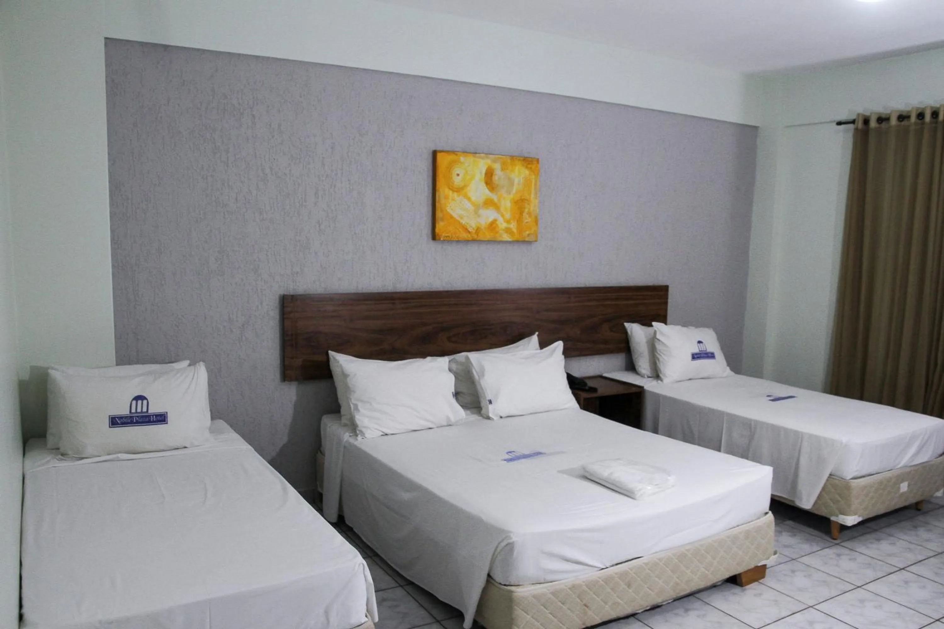 Bed in Nobile Plaza Hotel