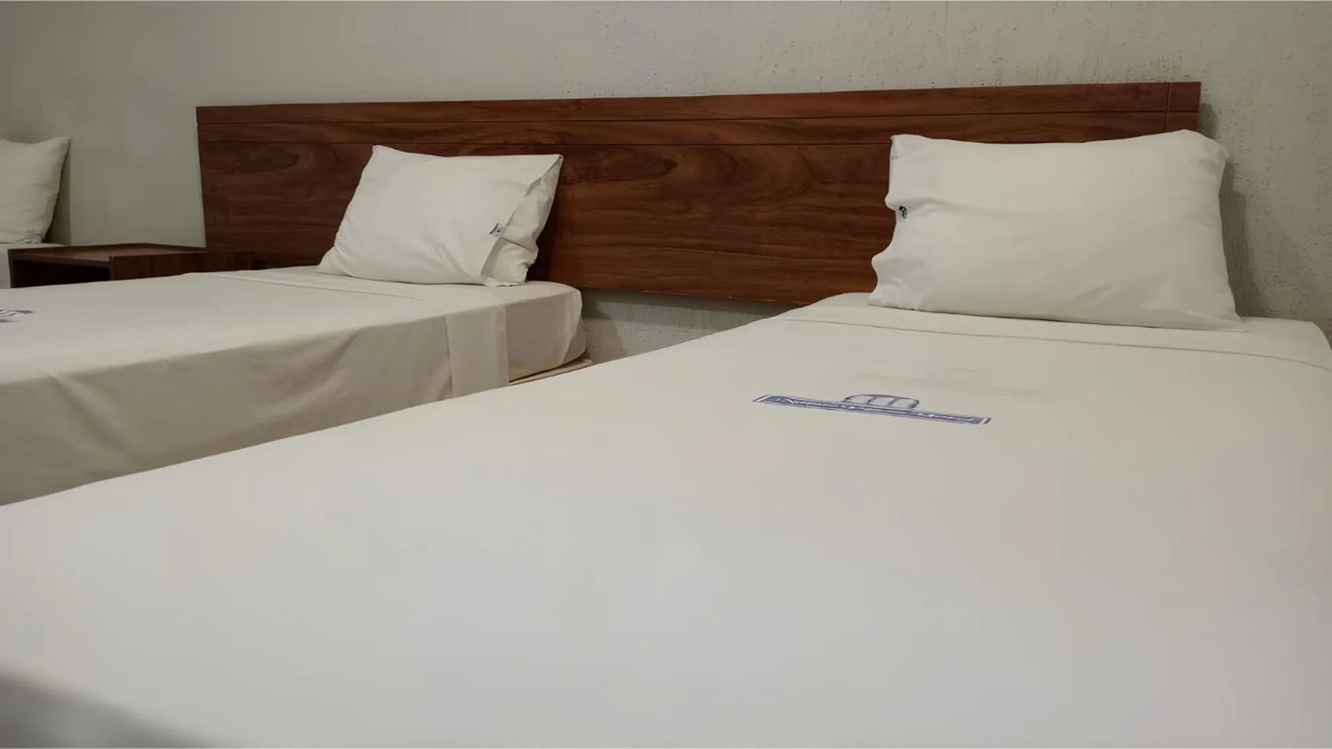 Bed in Nobile Plaza Hotel