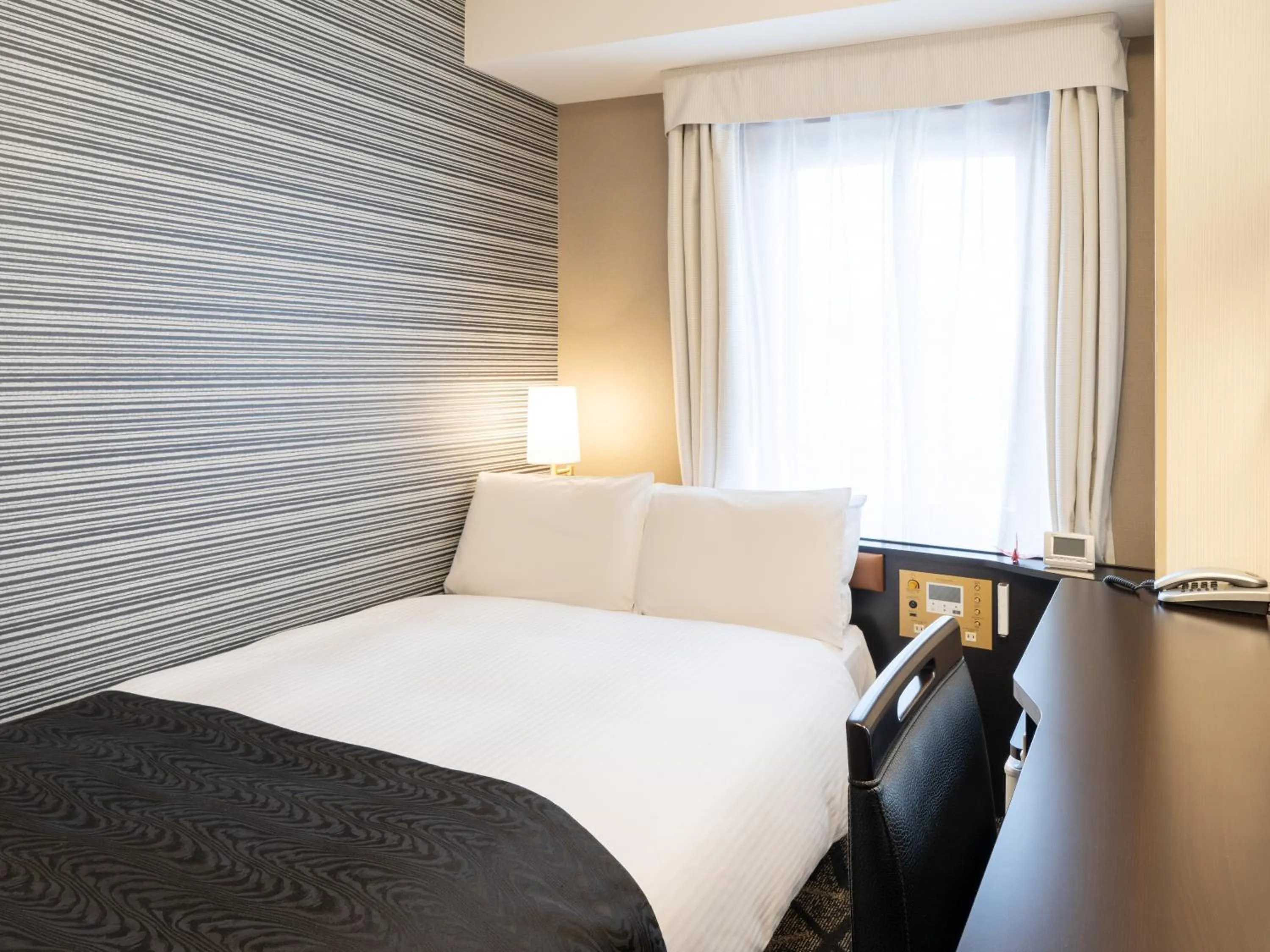 Photo of the whole room, Bed in APA Hotel Takasaki Ekimae