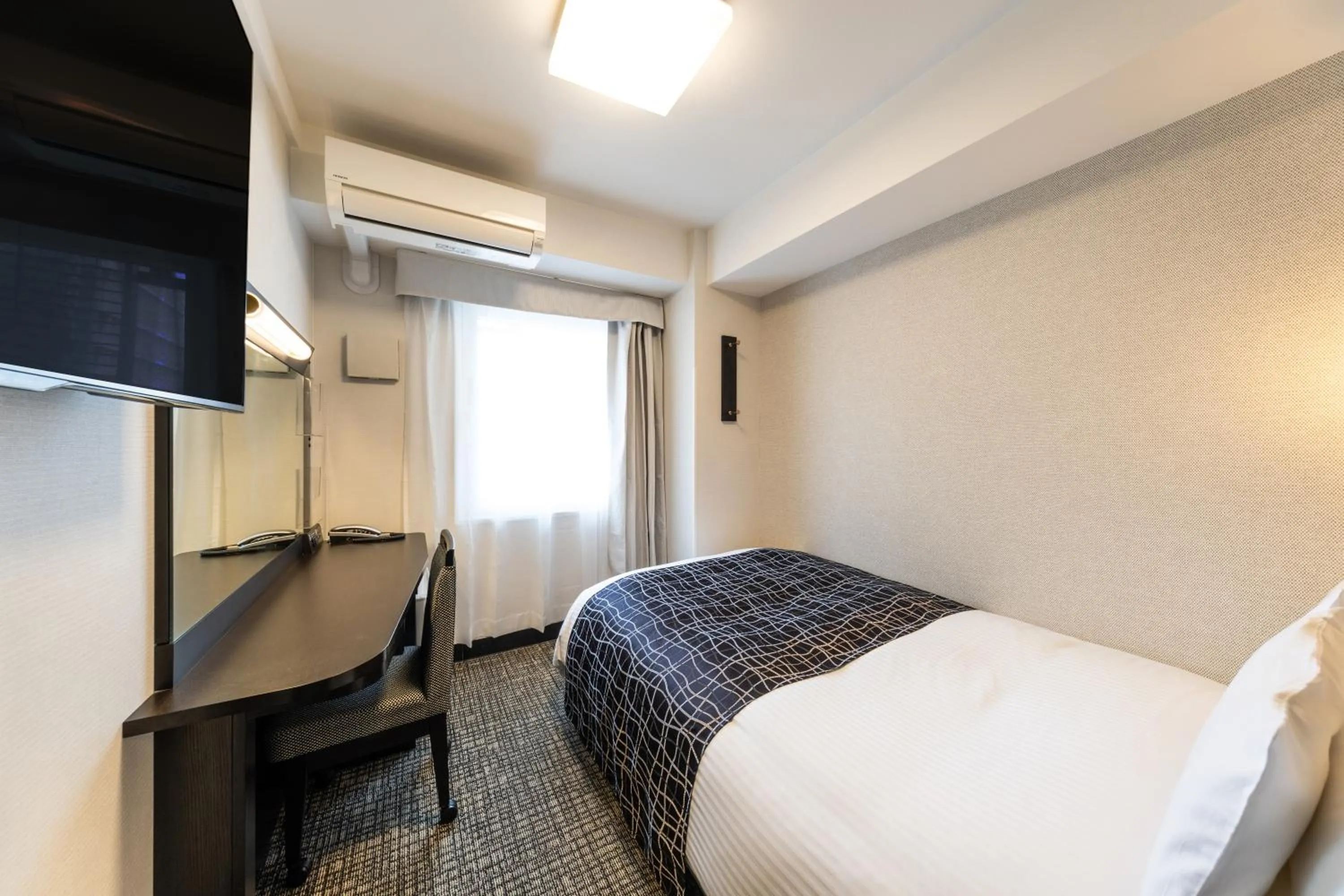 Bed in APA Hotel Kyoto Ekimae Chuoguchi