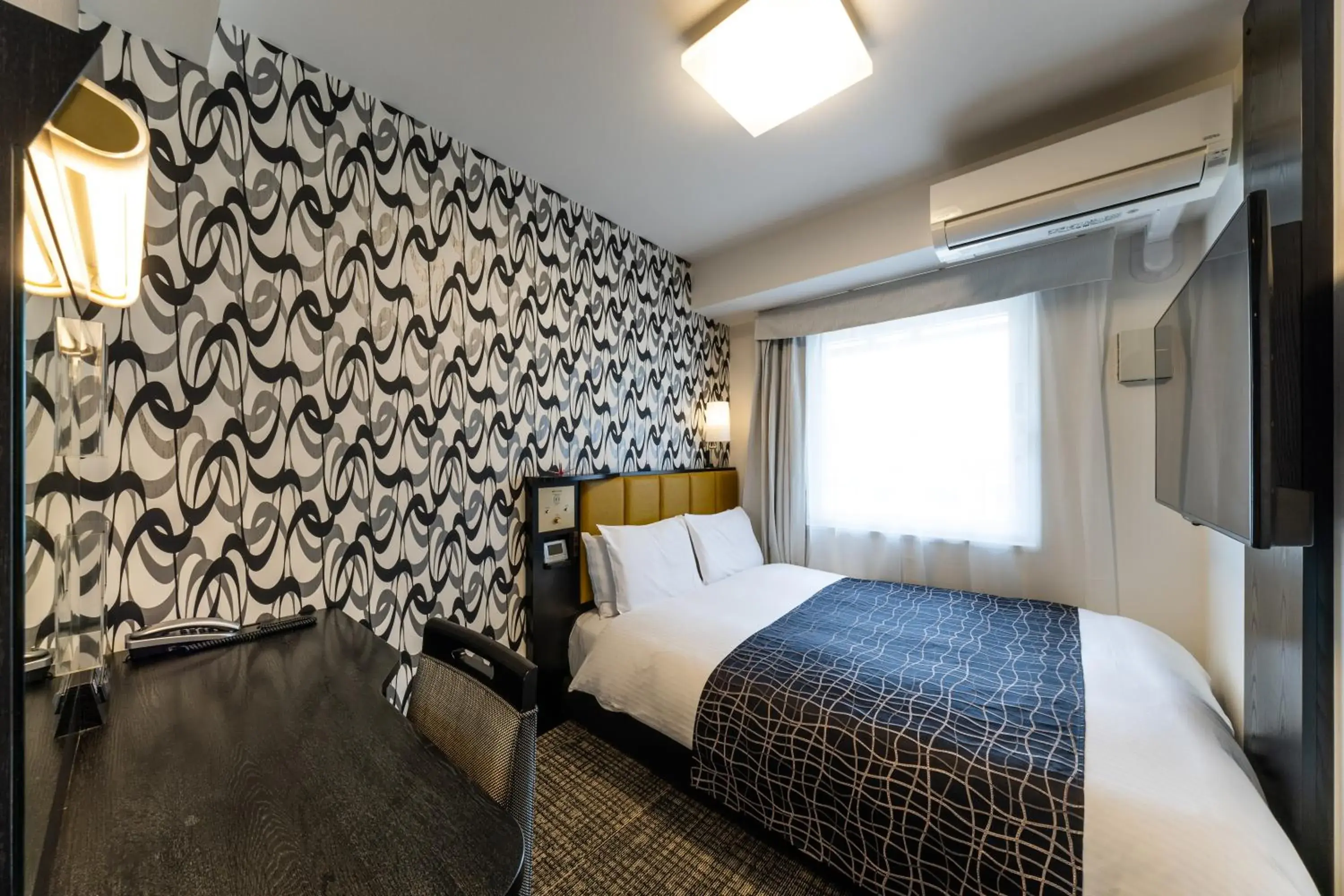 Bed in APA Hotel Kyoto Ekimae Chuoguchi Bed in APA Hotel Kyoto Ekimae Chuoguchi