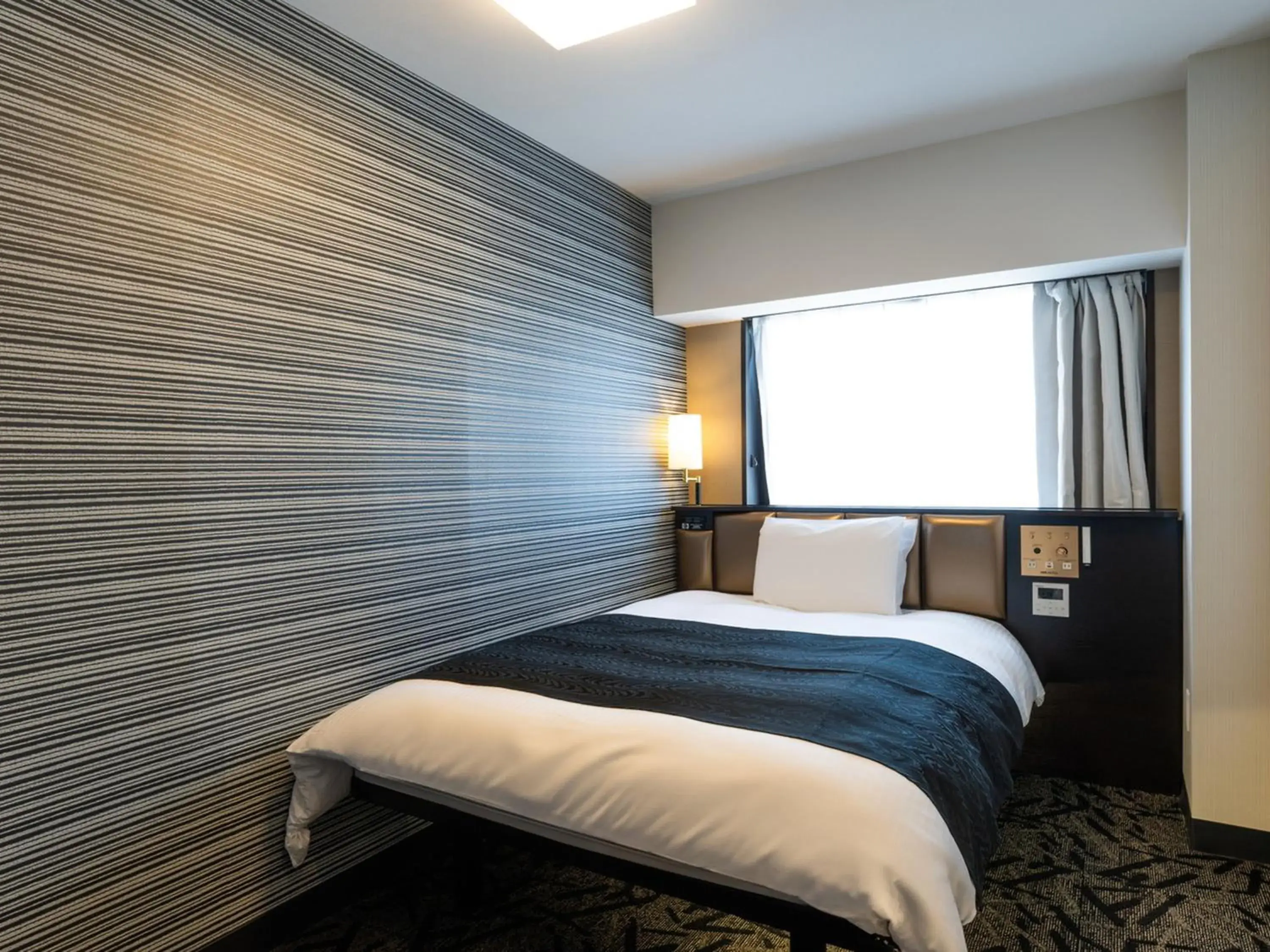 Bed in APA Hotel Tokyo Ojima Bed in APA Hotel Tokyo Ojima