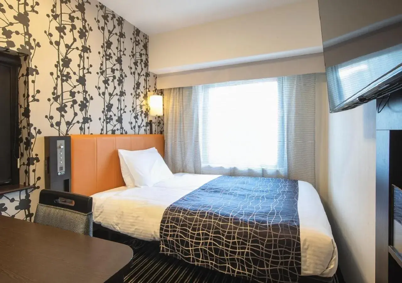 Bed in APA Hotel Namba Shinsaibashi Bed in APA Hotel Namba Shinsaibashi
