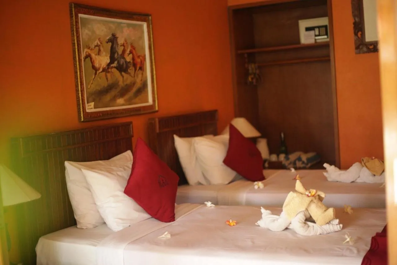 Bed in Kubuku Eco Dive Lodge and Yoga