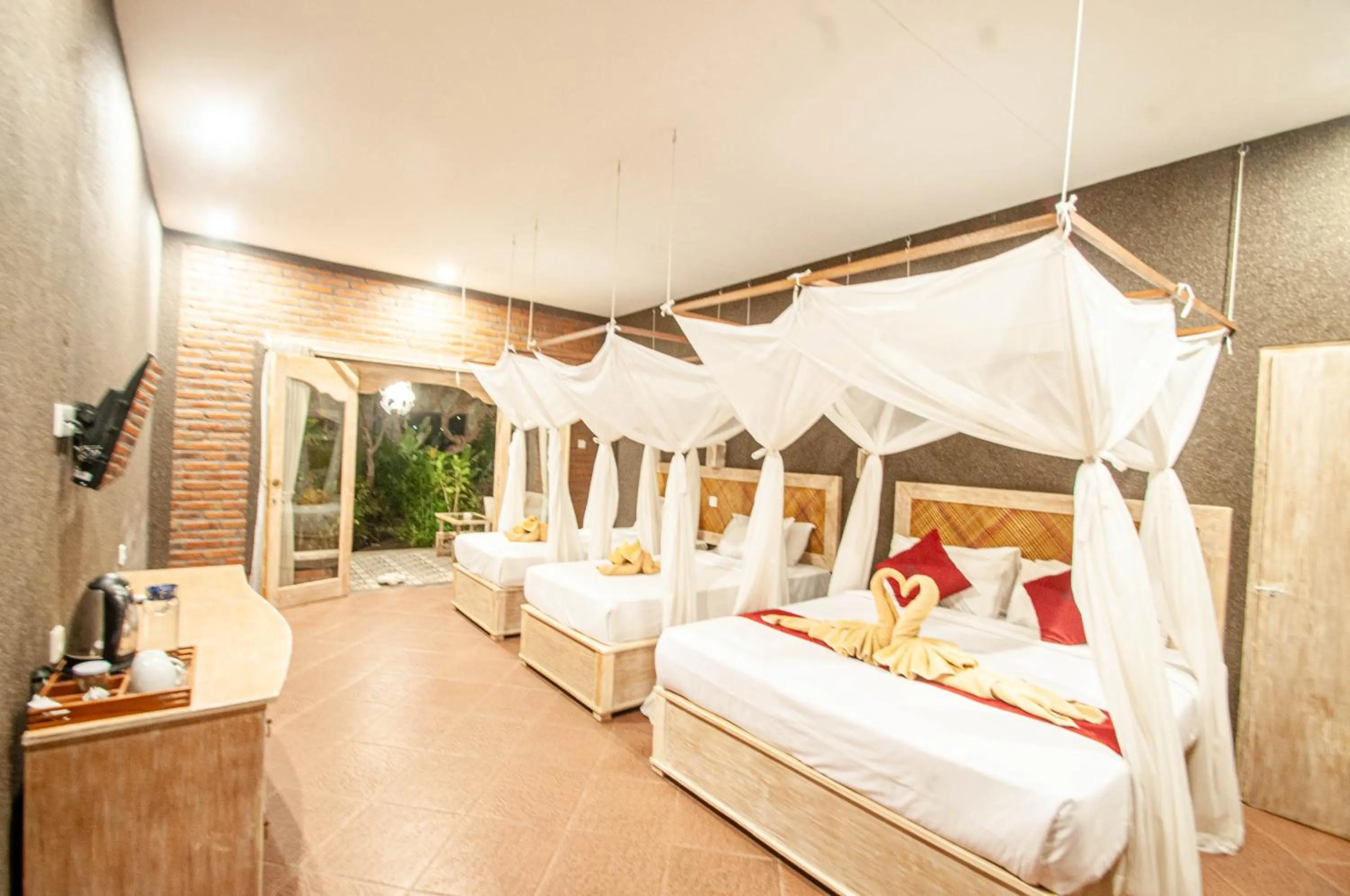 Bed in Kubuku Eco Dive Lodge and Yoga