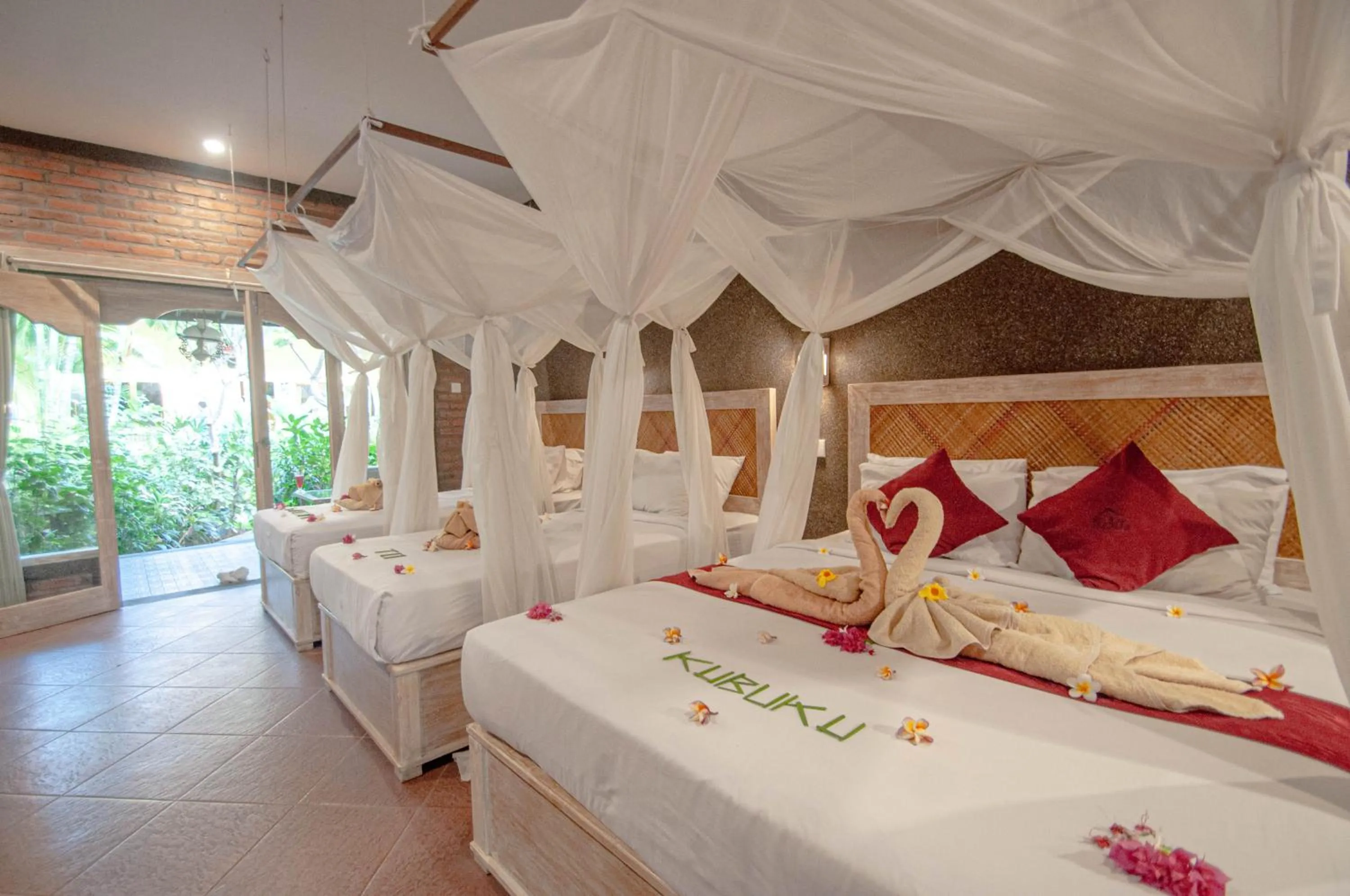 Bed in Kubuku Eco Dive Lodge and Yoga
