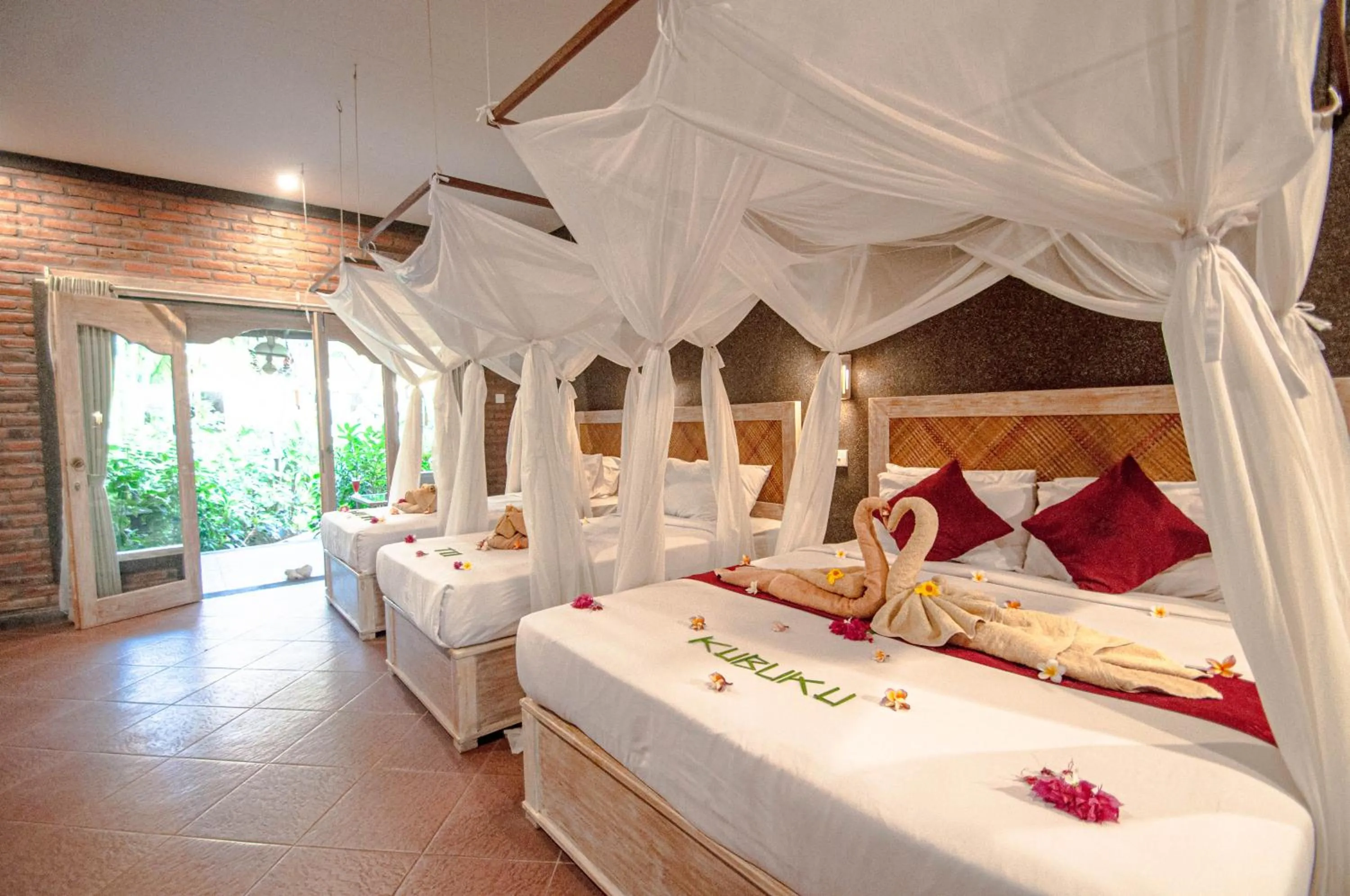 Bed in Kubuku Eco Dive Lodge and Yoga