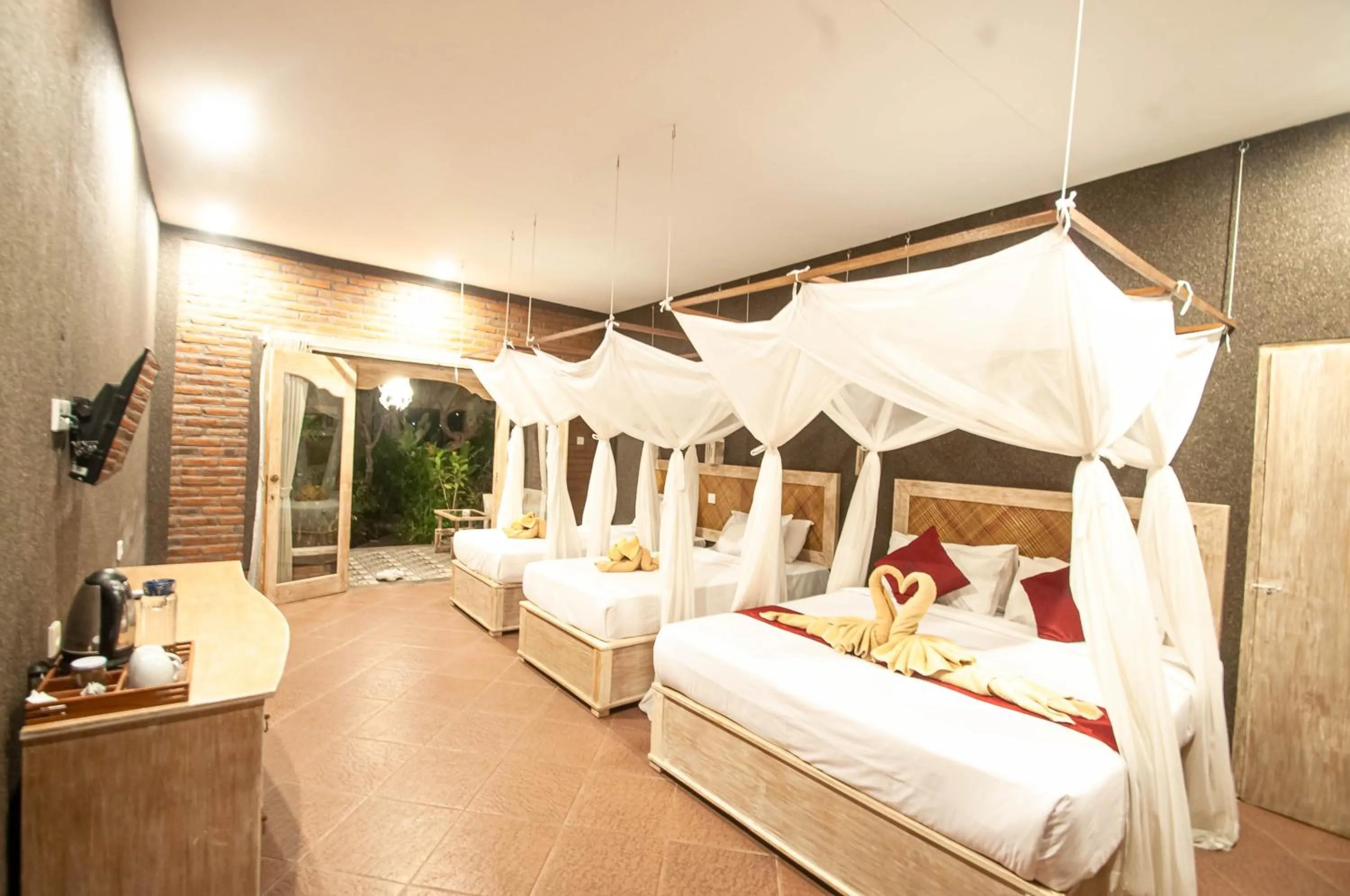 Bed in Kubuku Eco Dive Lodge and Yoga