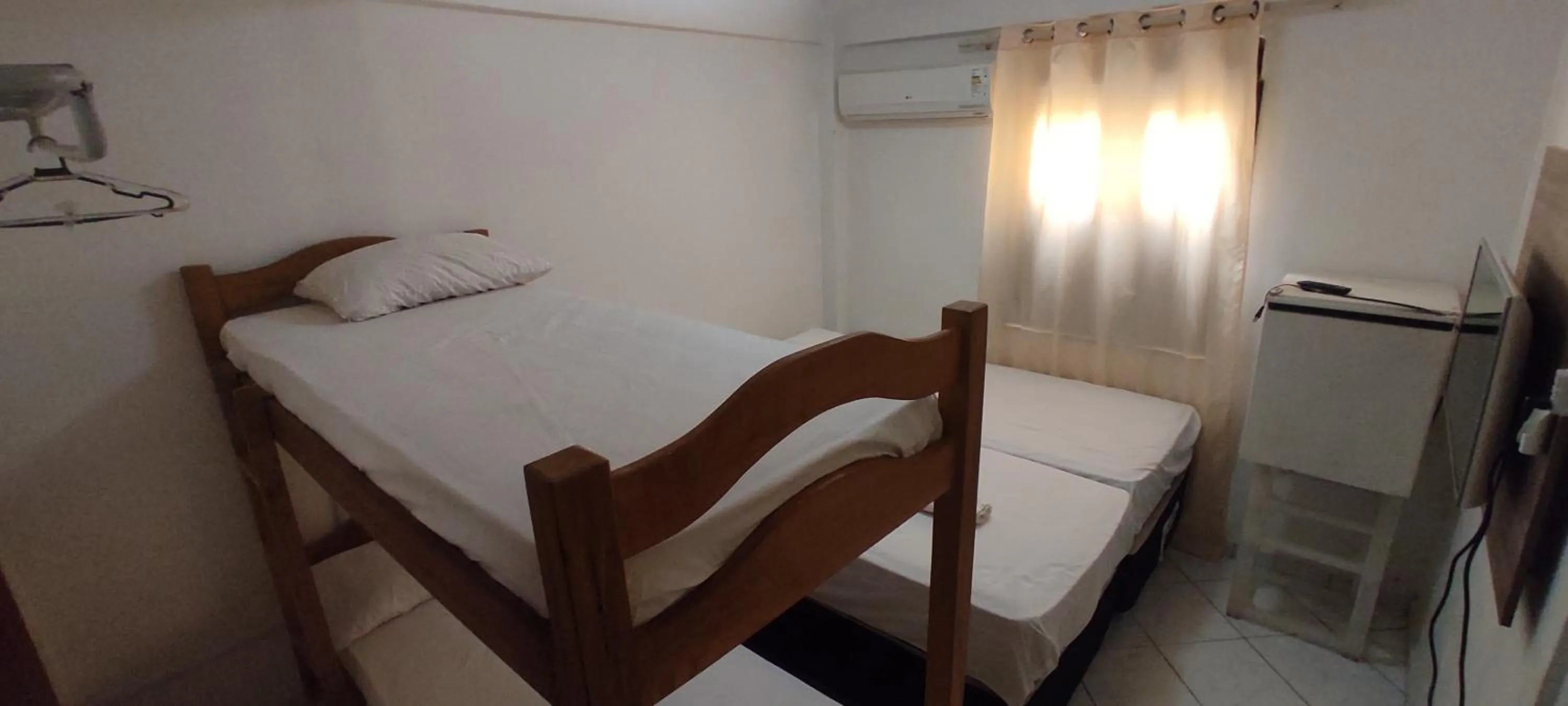 Bed in Pousada Zumbi dos Palmares