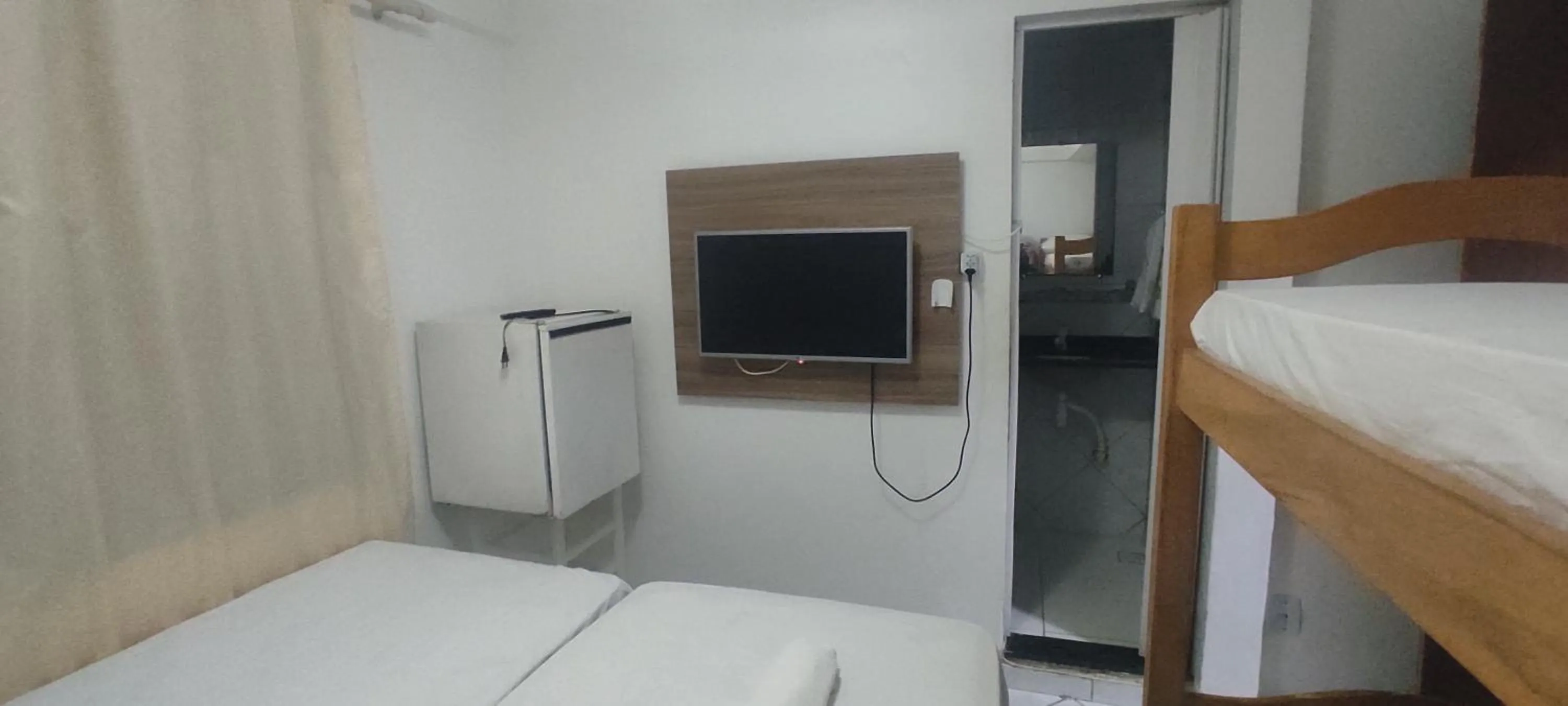 Bed in Pousada Zumbi dos Palmares