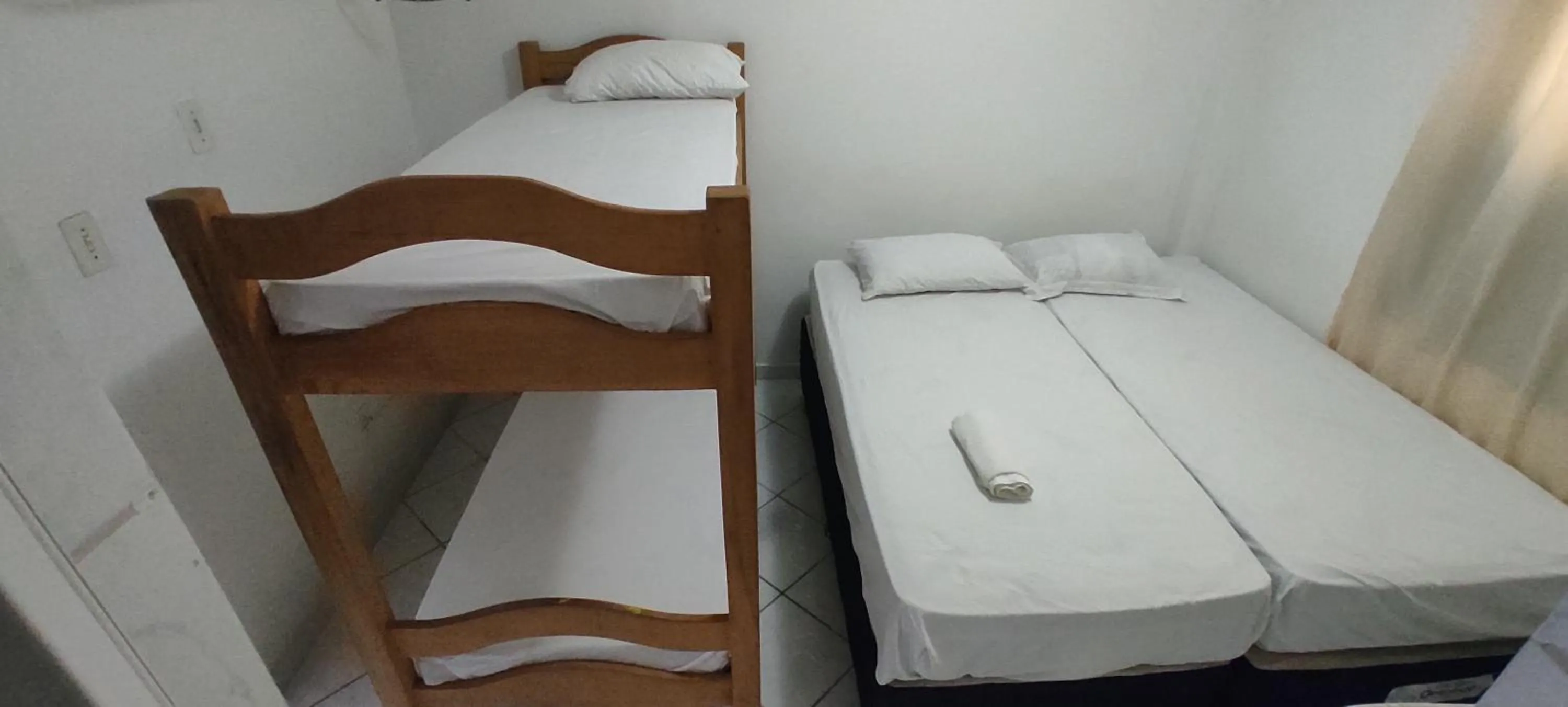 Bed in Pousada Zumbi dos Palmares