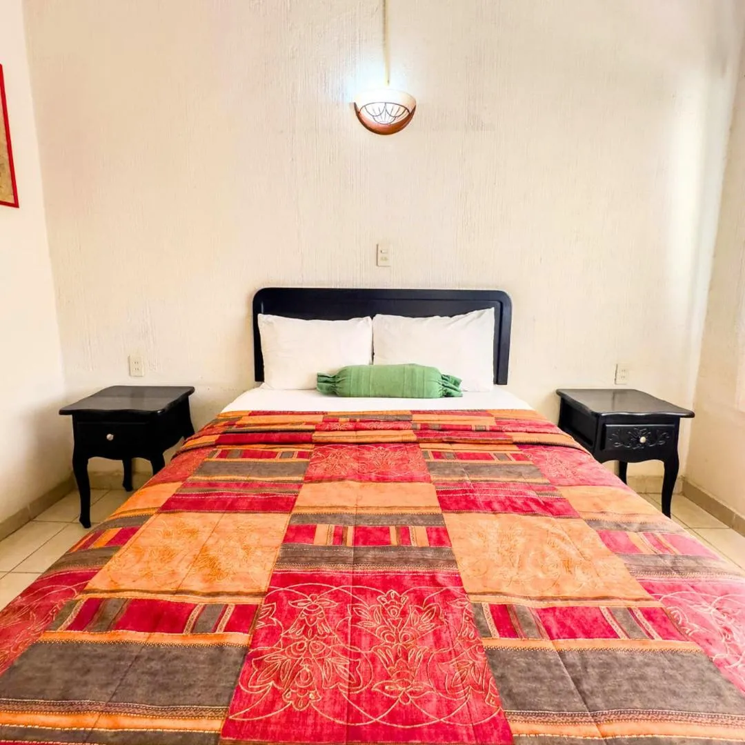 Bed in Villas del Sol Hotel & Bungalows