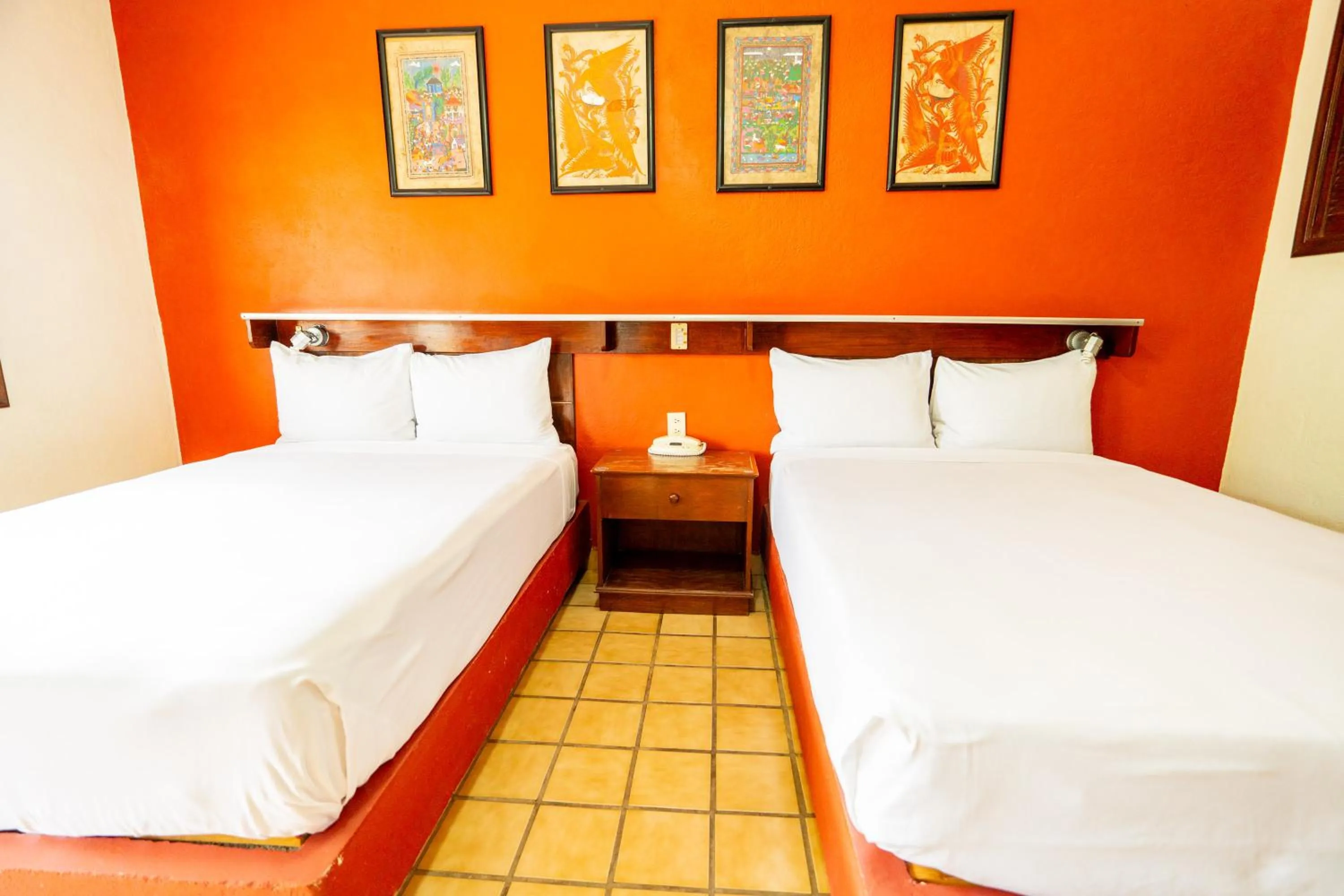 Bed in Villas del Sol Hotel & Bungalows