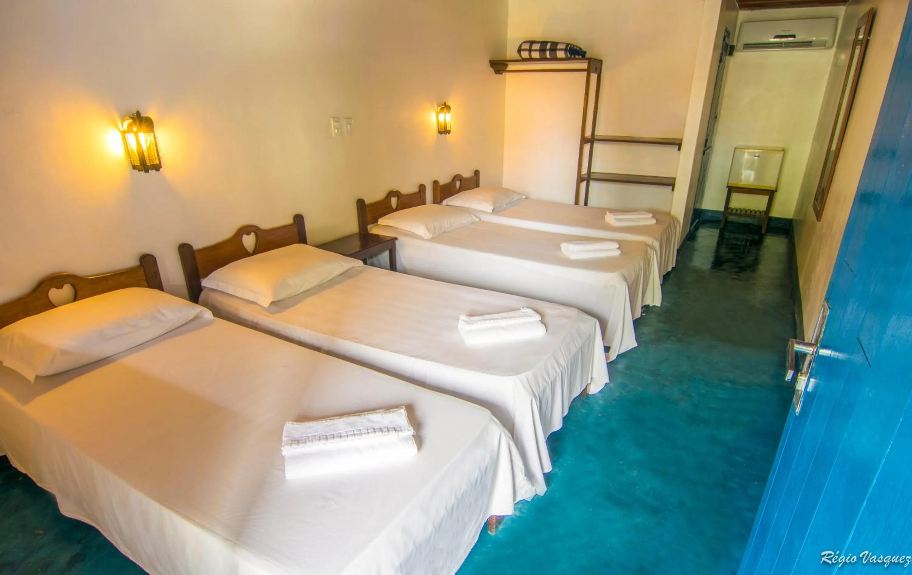 Bed in Pousada Sao Luiz