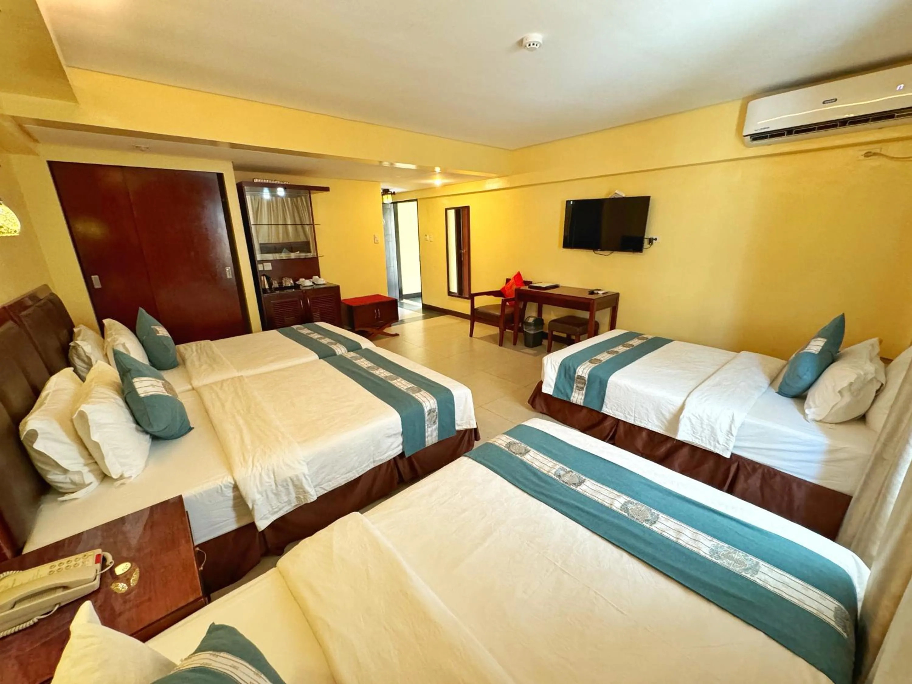 Bed in Golden Phoenix Hotel Boracay