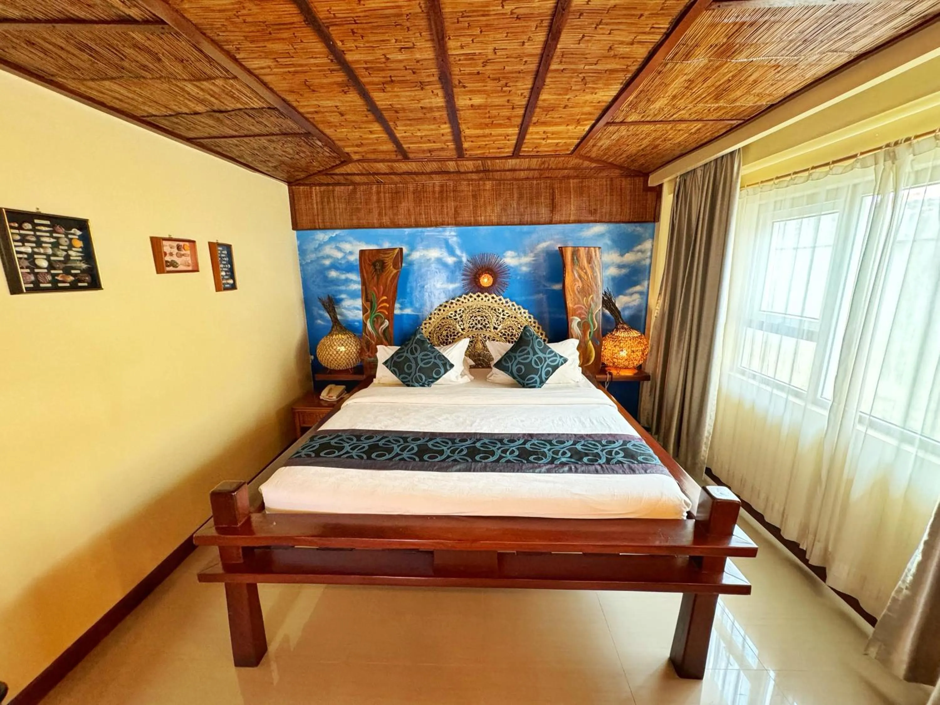 Bed in Golden Phoenix Hotel Boracay