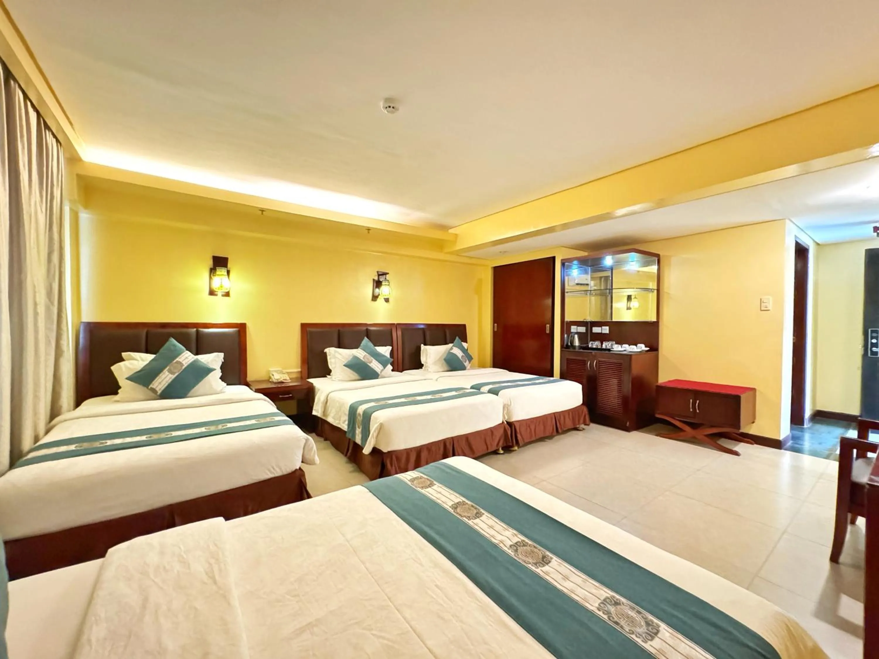 Bed in Golden Phoenix Hotel Boracay