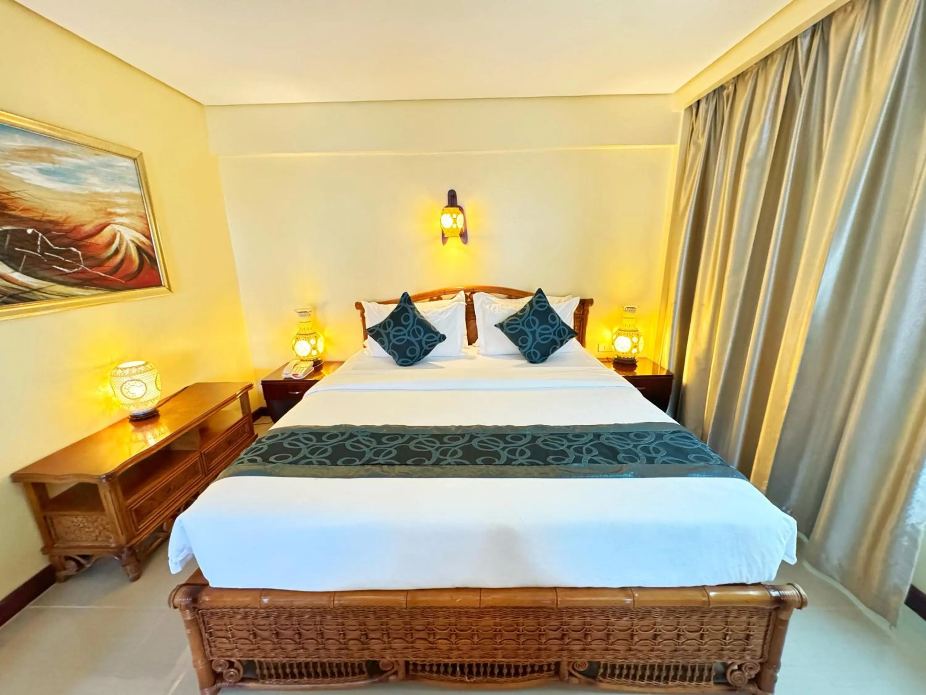 Bed in Golden Phoenix Hotel Boracay