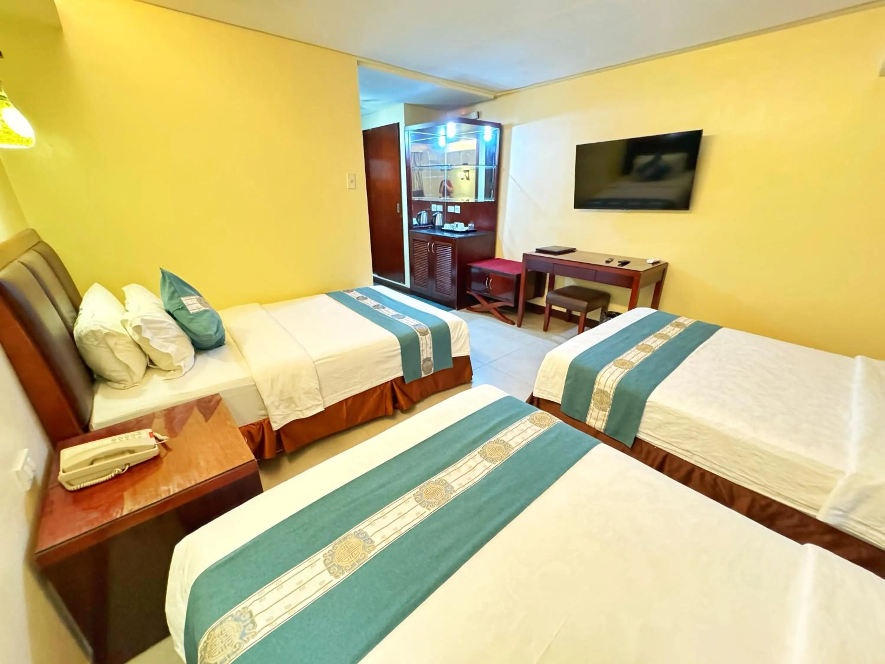 Bed in Golden Phoenix Hotel Boracay