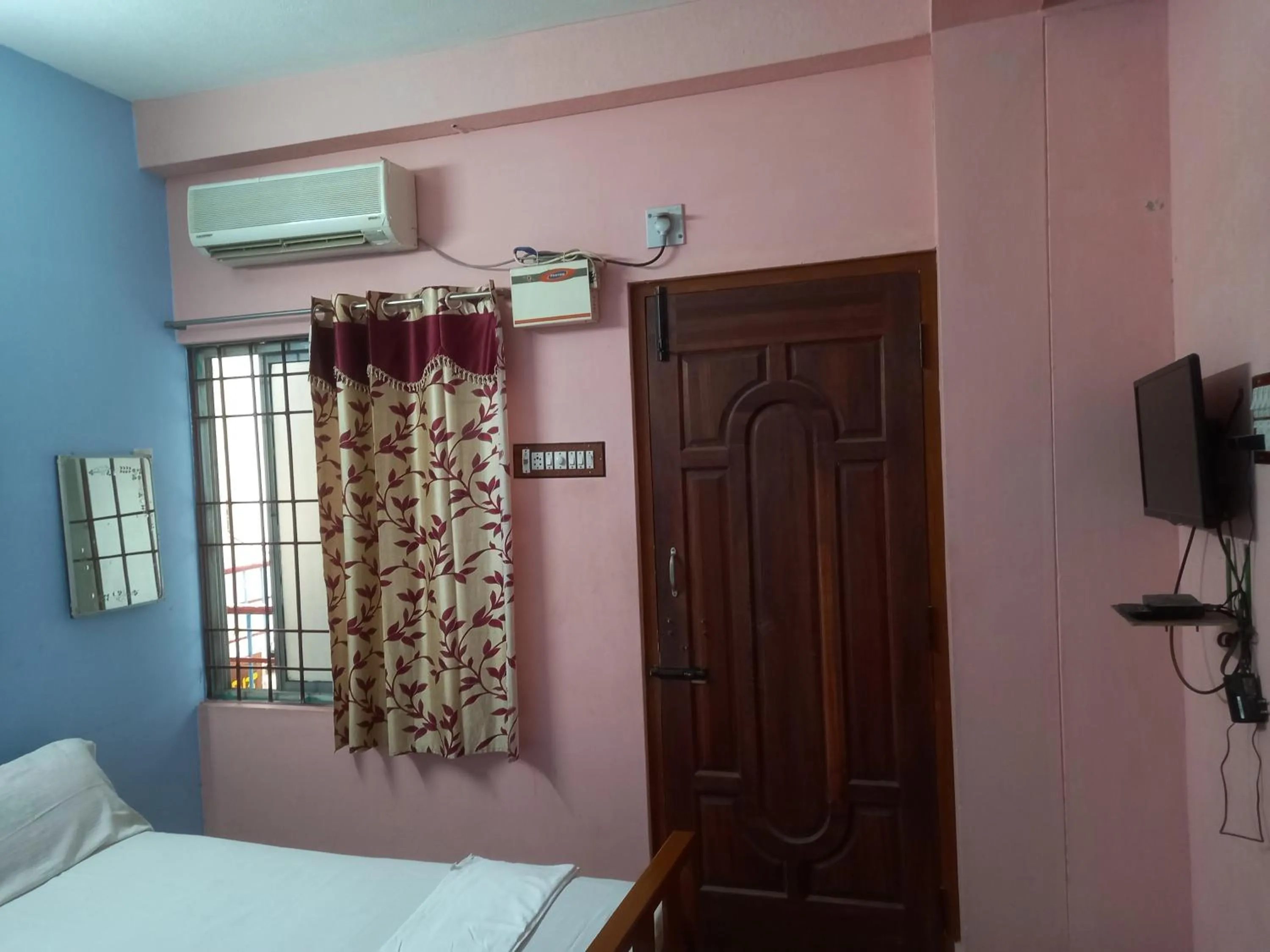 Budget Double Room in Parisha Residency- Temple Side Hotel