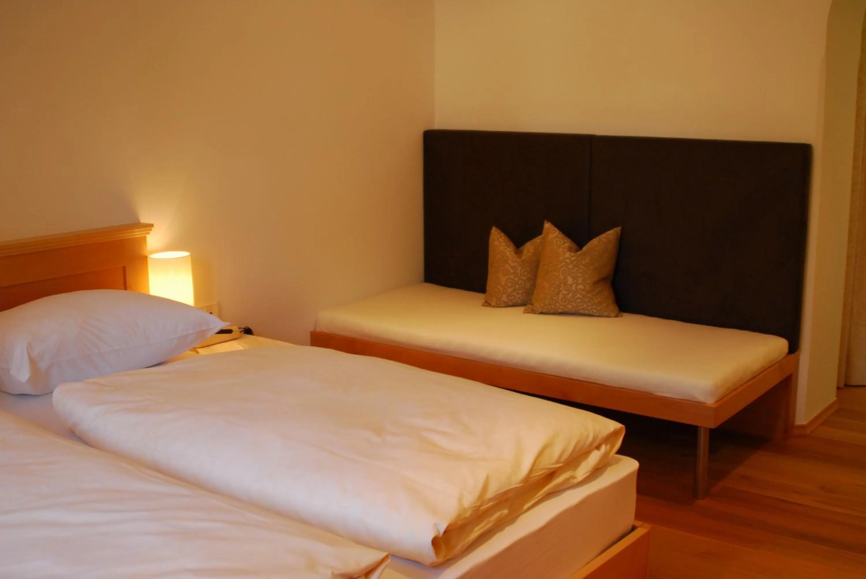 Bed in Hotel Dolomiten