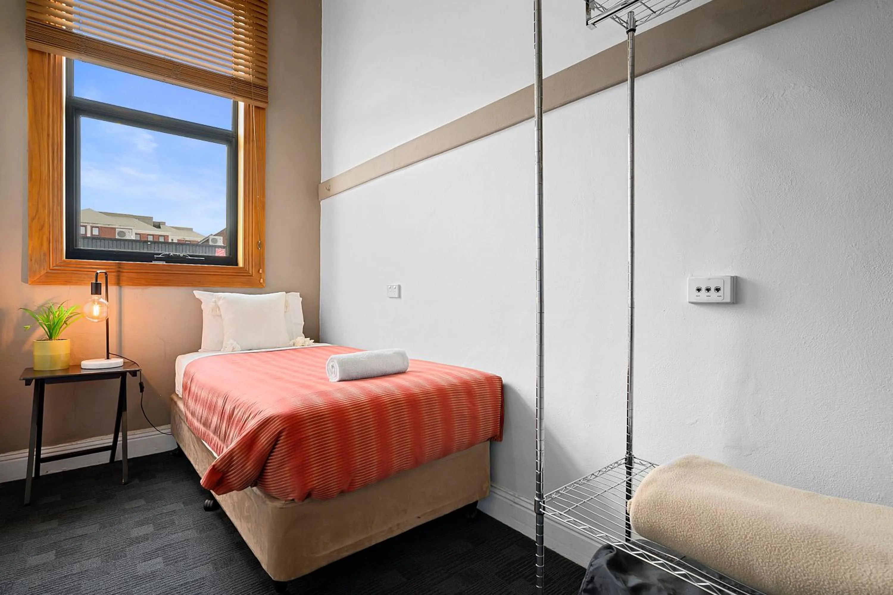 Bed in Burnie City Apartments