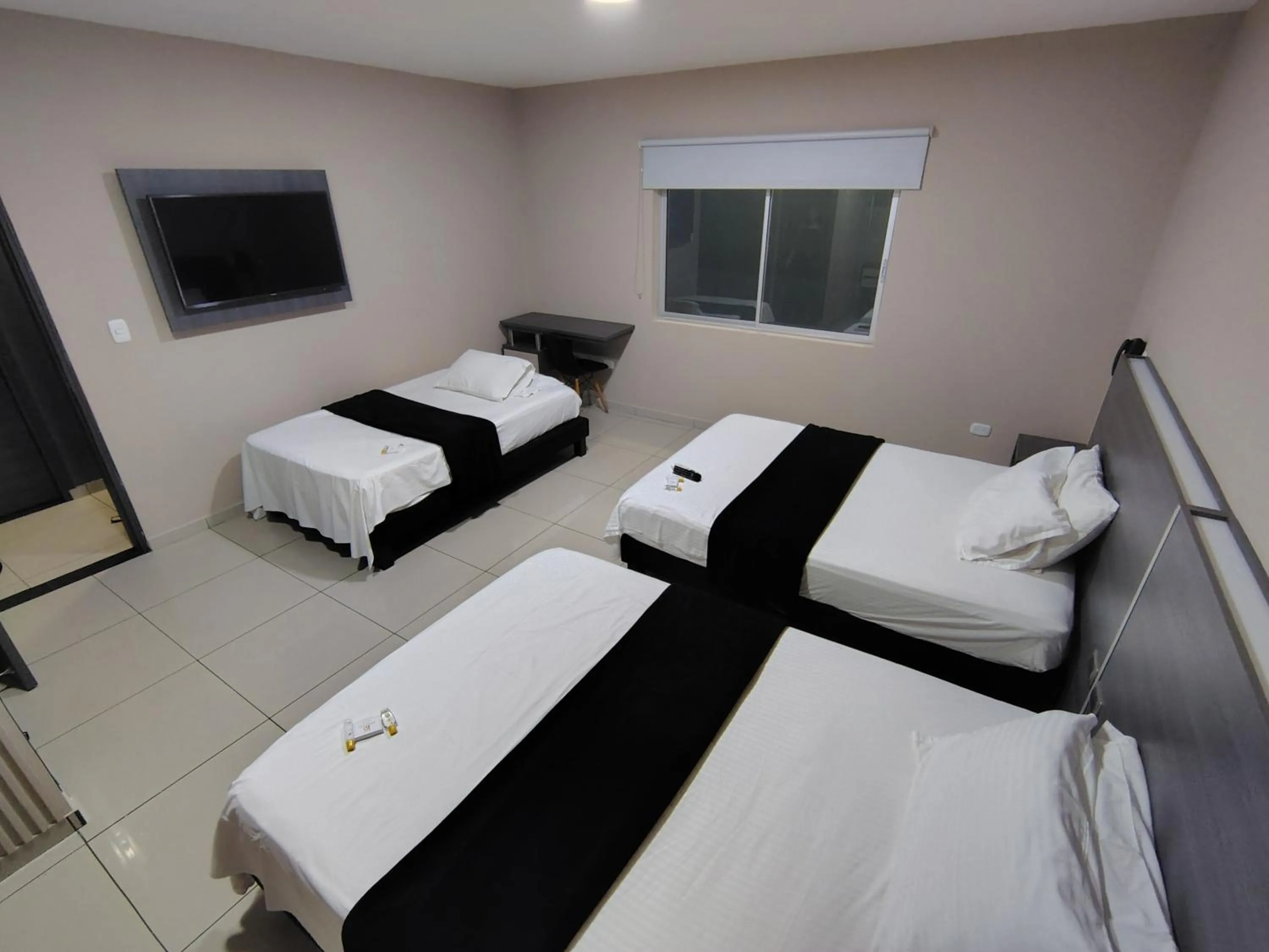 Bed in Hotel Doral Inn